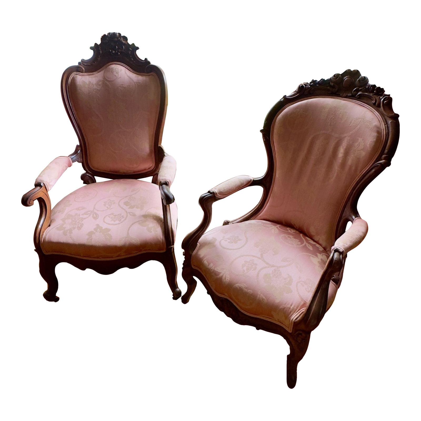 Mid 19th Century Victorian Carved Rosewood Parlor Chair Set: 19th C Victorian Parlor Chairs, featuring rosewood frames ornate carving and light pink damask upholstery, cabriole legs. Gentleman's chair has full armrests. Ladies chair has sloping open arm rests s