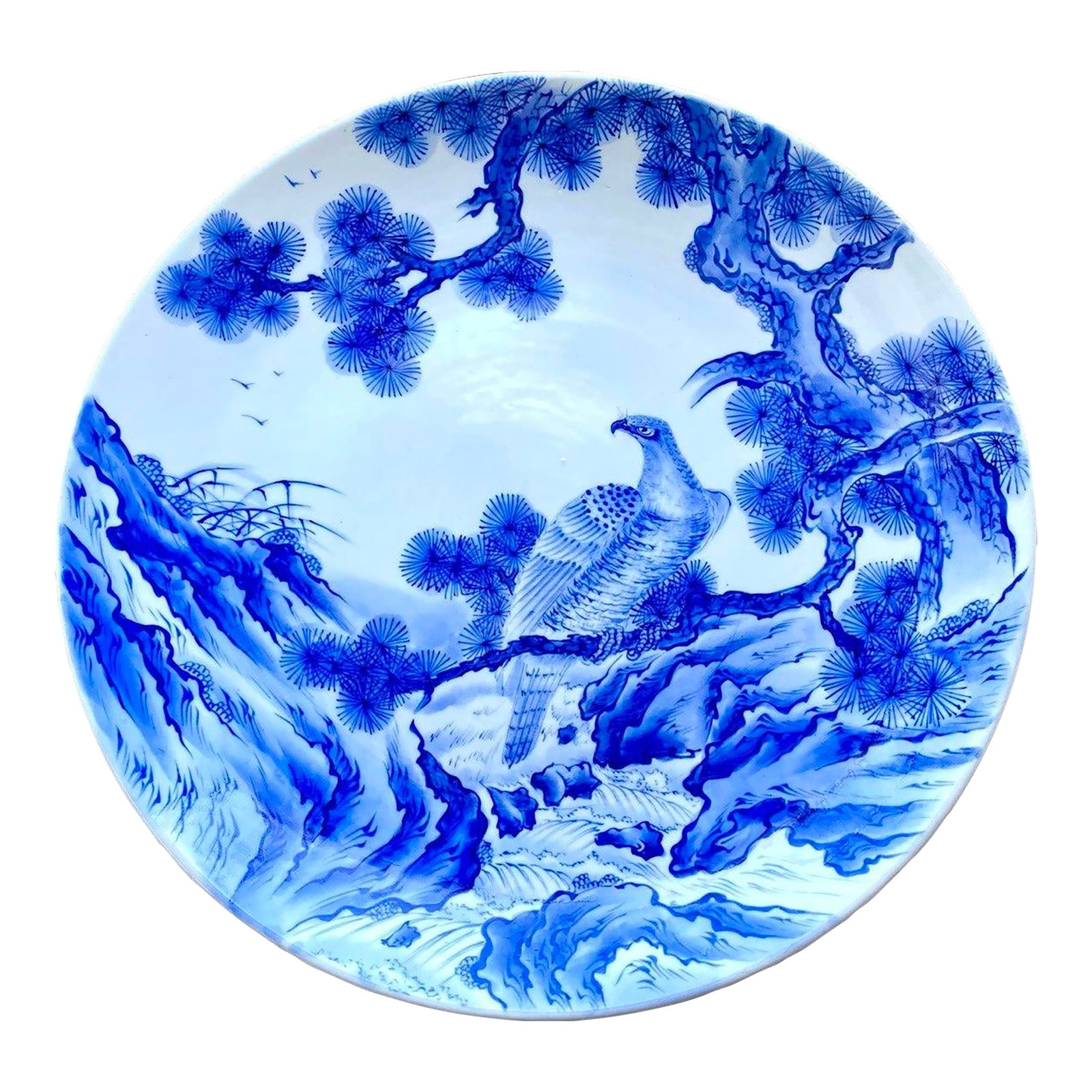Mid 20th Century Monumental Japanese Blue & White Porcelain Charger With Hawk & Pine Landscape: An exceptional large-scale Japanese blue and white porcelain charger featuring a majestic hawk perched among ancient pines overlooking a mountainous landscape. Executed entirely in cobalt blue