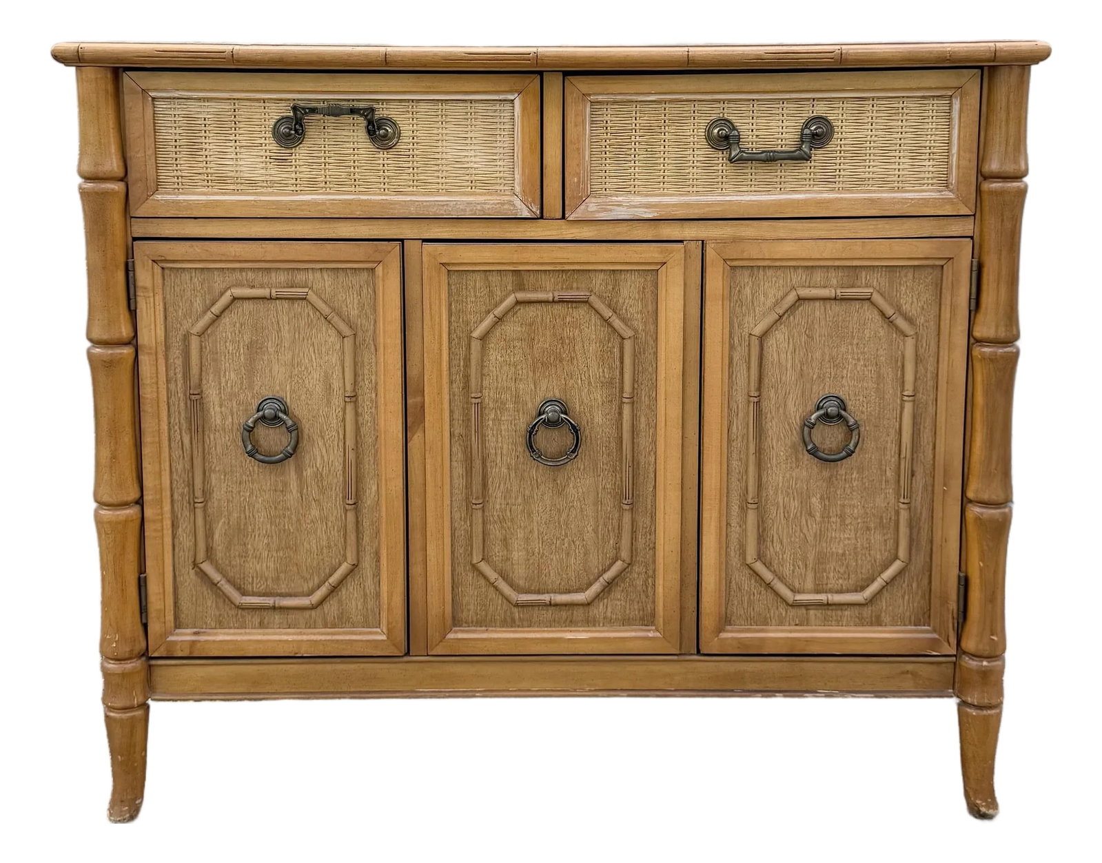 Boho Chic Faux Bamboo and Wicker Sideboard by Broyhill: A charming Boho Chic sideboard by Broyhill featuring warm oak-toned wood, faux bamboo detailing, and woven wicker drawer fronts. The versatile design includes two spacious drawers above three cabinet 