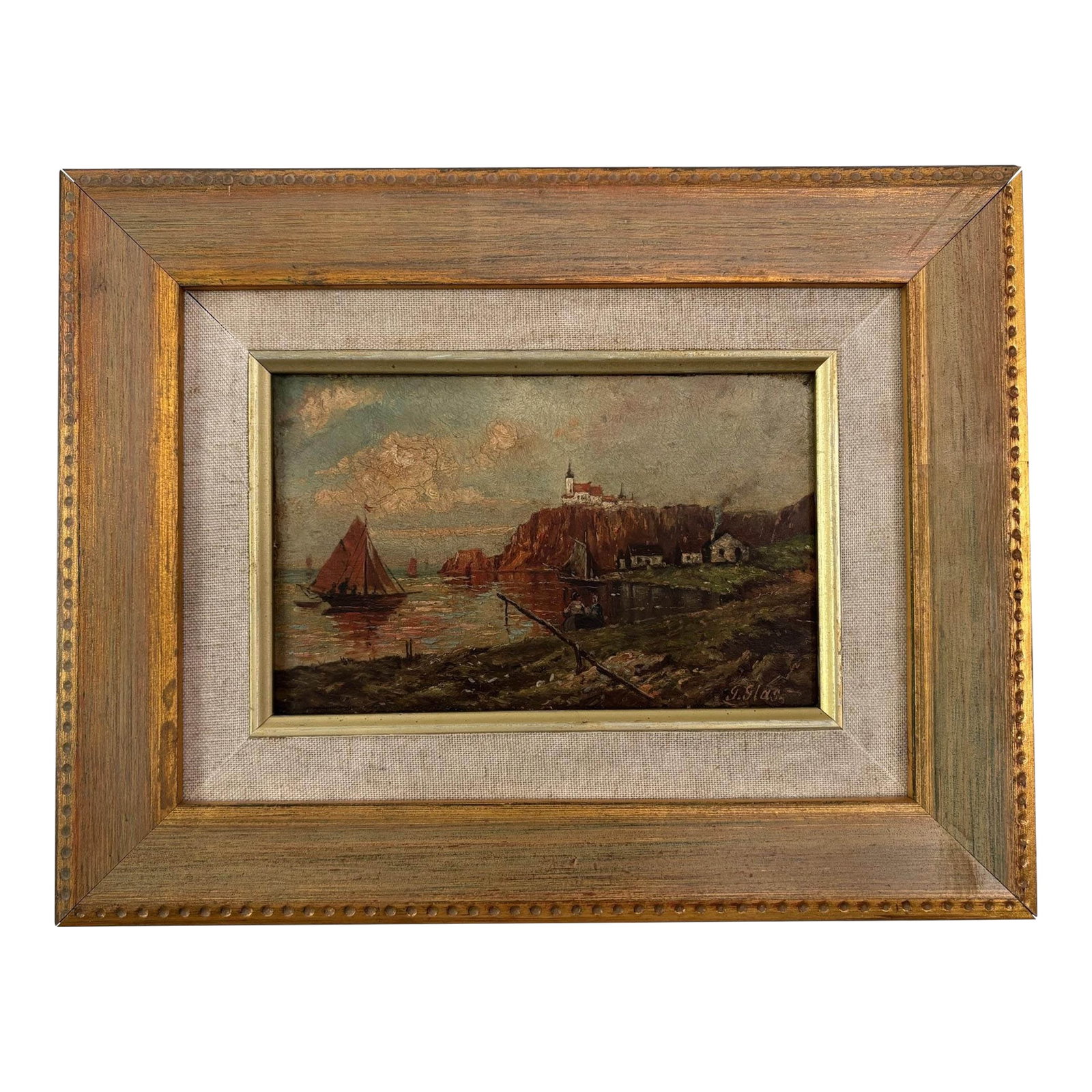 Antique 20th Century European Coastal Seascape Oil Painting - Framed: Capture the timeless charm of the European coast with this original vintage oil painting signed "G. Glas," depicting a picturesque harbor scene with sailboats, rugged seaside cliffs, and a quaint vill