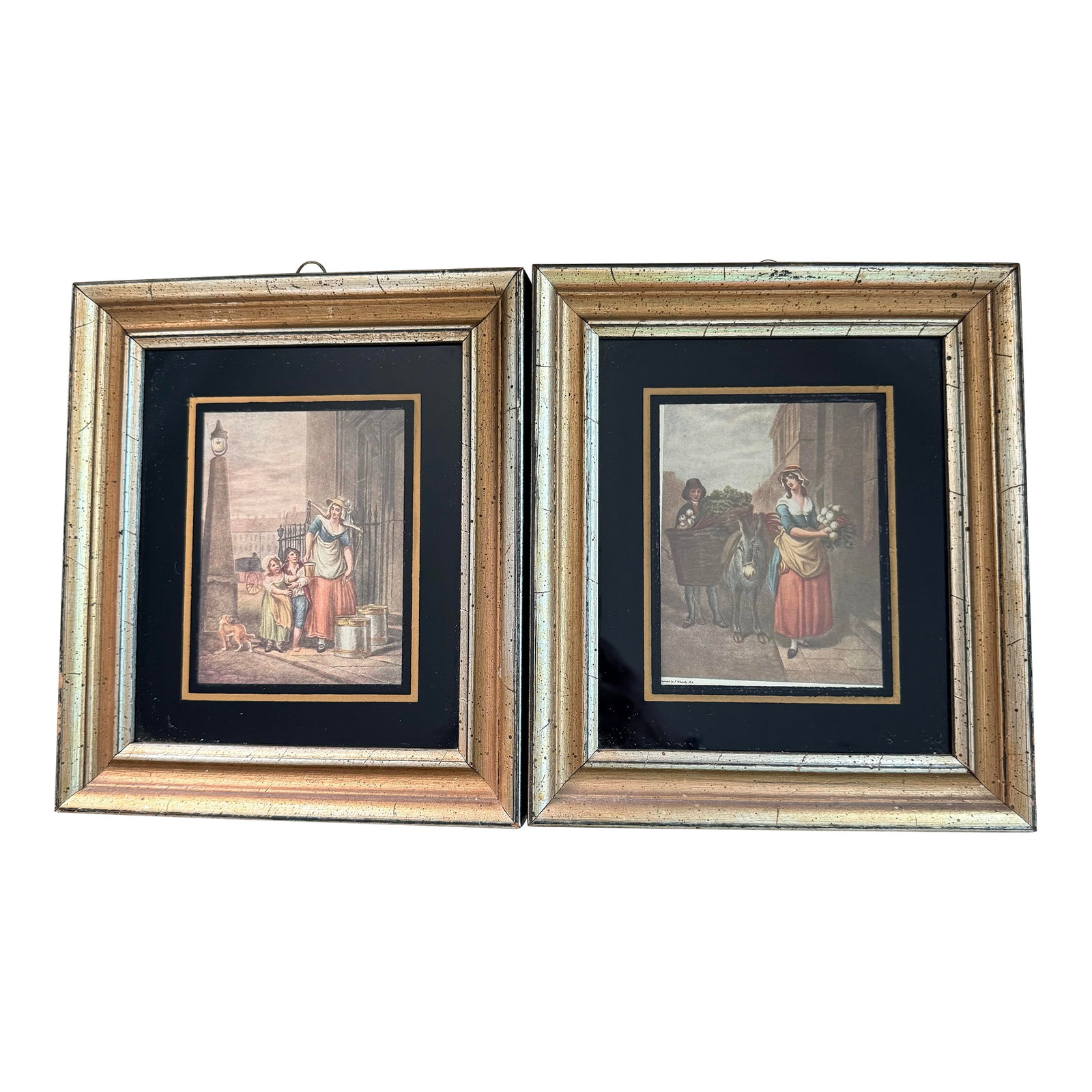 Two Victorian Maiden Lithographs Framed: Framed lithographs with black mats and silver/ gold frames. One picture is of a milk maid delivering milk and the other is a maiden delivering vegetables. Condition: Alterations: Original Condition
