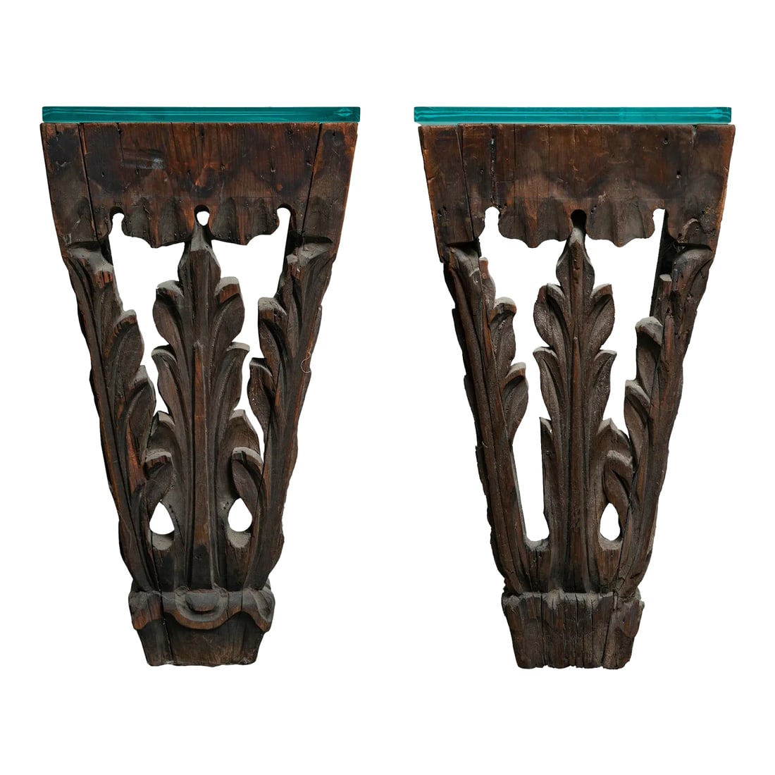 Early 20th Century Pair of Antique Hand Carved Wall Hung Side Tables: An Unusual Pair of Antique Hand Carved Wall Hung Side Tables with thick glass top; frosted on underside. They were repurposed from Antique Architectual Adornments. These have been in my personal colle