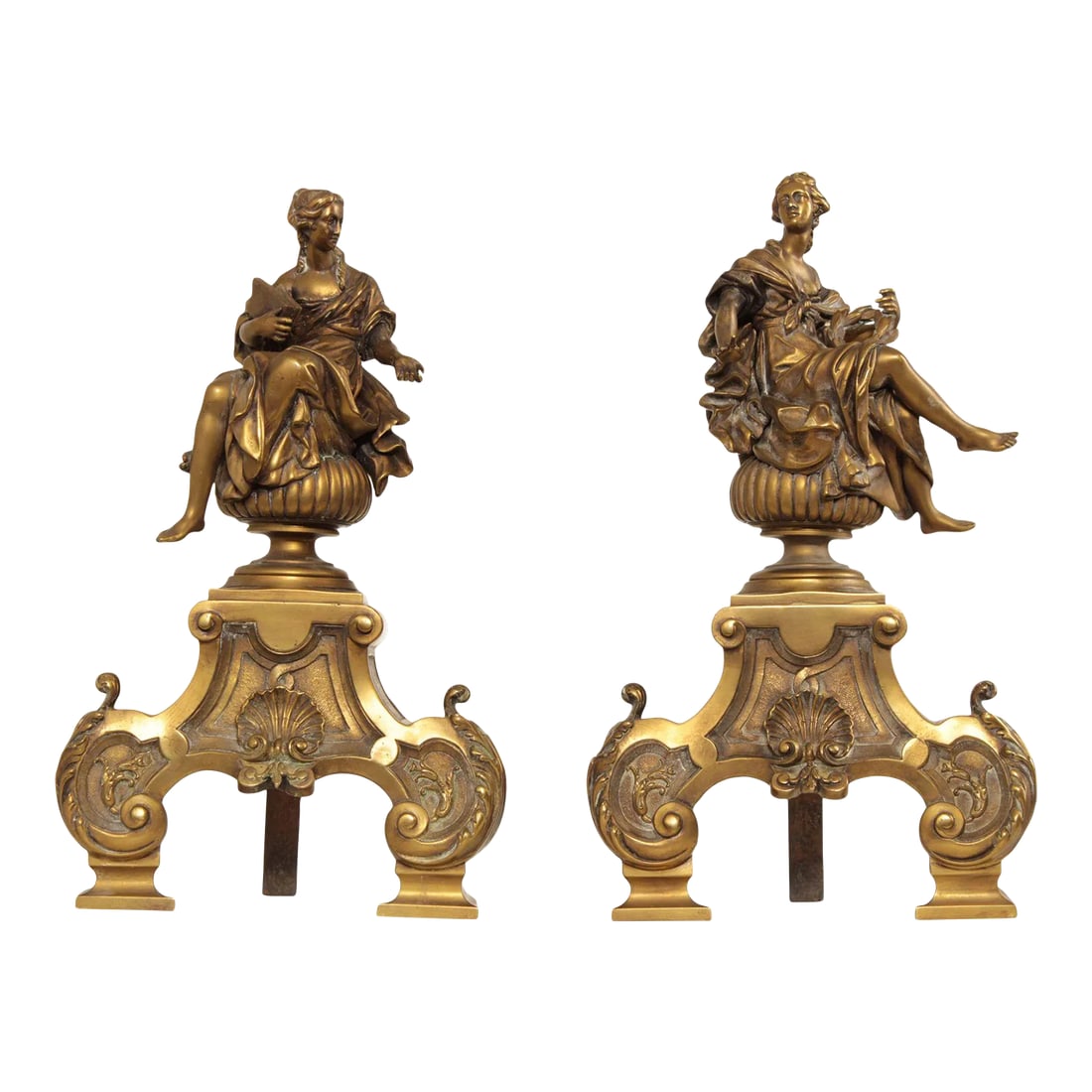 Antique 19th Century French Neoclassical Brass Chenets - A Pair: Fine Quality Antique Pair of French Brass Andirons in the Neoclassical Taste, Each with Classical Figure Mounted Above Foliate Scroll and Shell Form Base Condition: Alterations: Original Condition