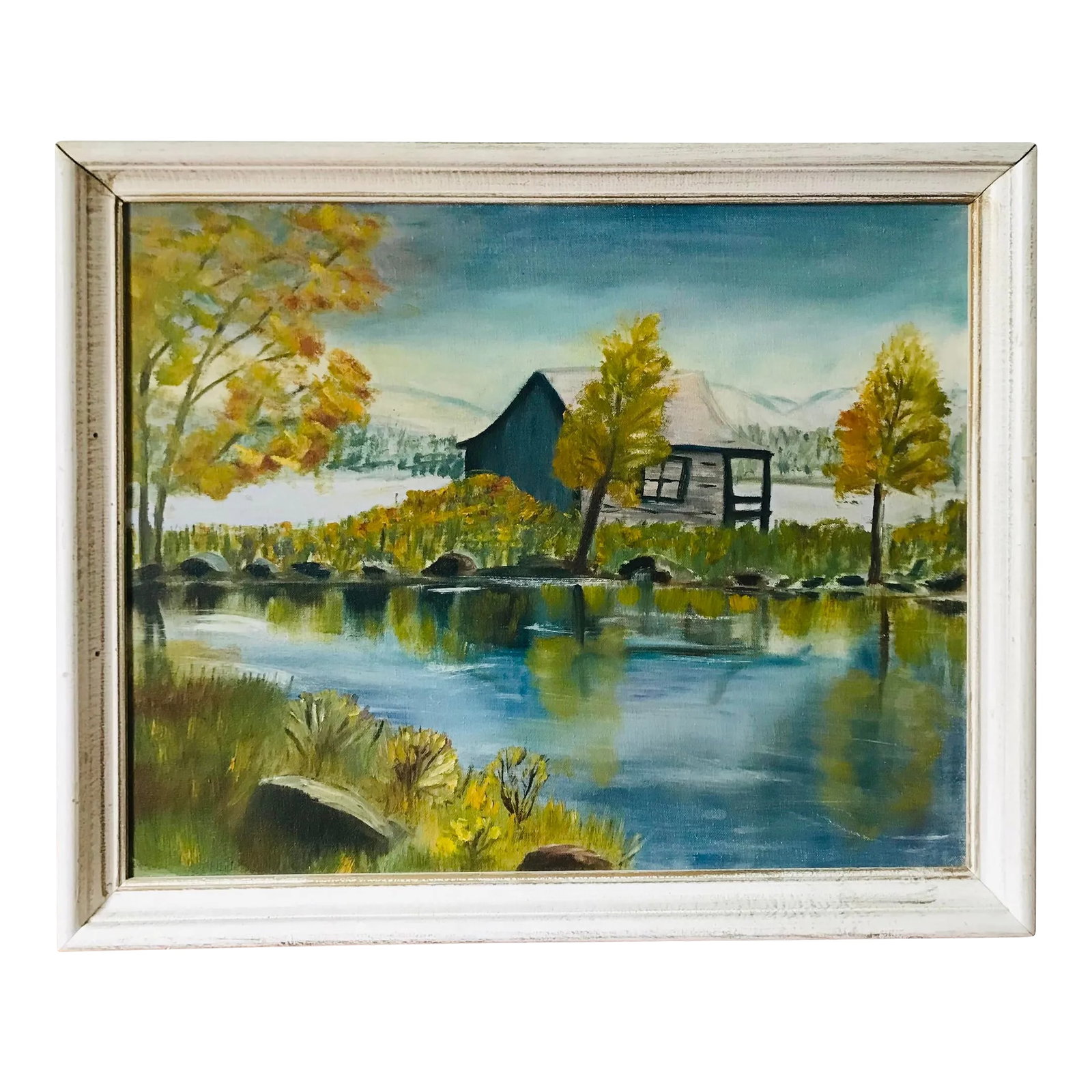 Vintage Cottage-Core Cabin on a Lake Oil Painting - Framed: Unsigned vintage painting in a white wood frame Condition: Alterations: Original Condition Unaltered Imperfections: Some Imperfections Condition Notes: Frame shows some wear as pictured. Materials