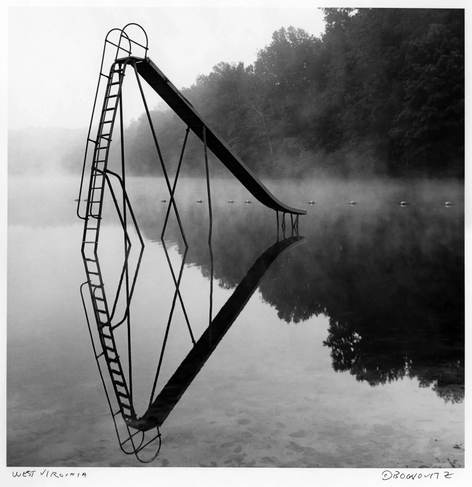 West Virginia, Slide, 1993, Silver Gelatin Photograph, Murray Bognovitz: West Virginia, Slide, 1993, Silver Gelatin Photograph, Murray Bognovitz Medium: Silver Gelatin Selenium Toned Fiber Print Edition: Open Signed and titled recto Condition: Mint Dimensions 9" x 9" on 11