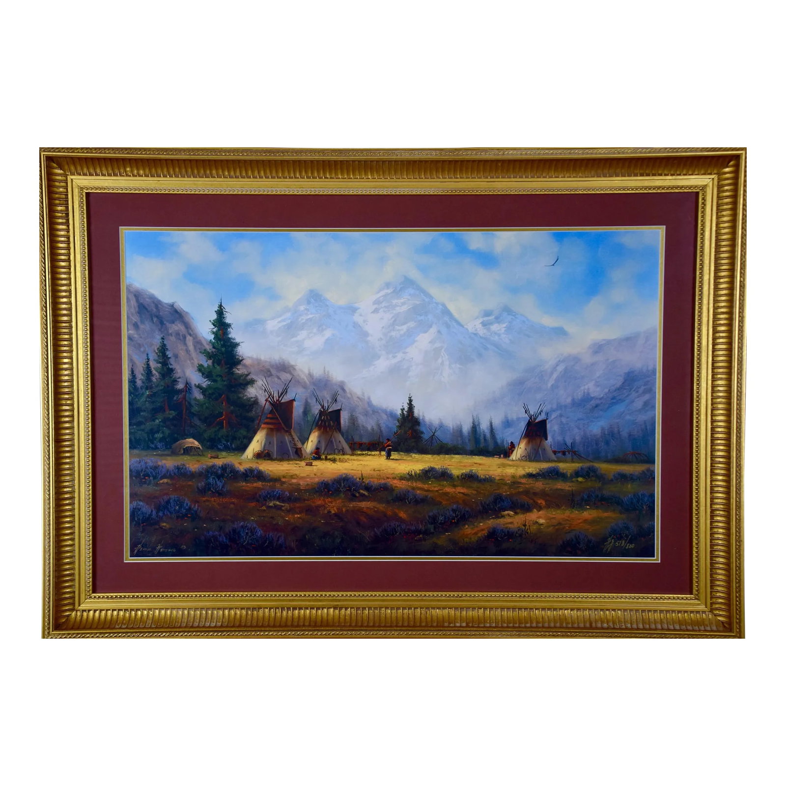 Native American Encampment in a Valley, Limited Edition Hartwig Signed Print: This is a limited edition print from a painting by Heine Hartwig (1937- ) depicting a Native American encampment in a meadow at the base of majestic mountains. The print is signed & numbered in gold