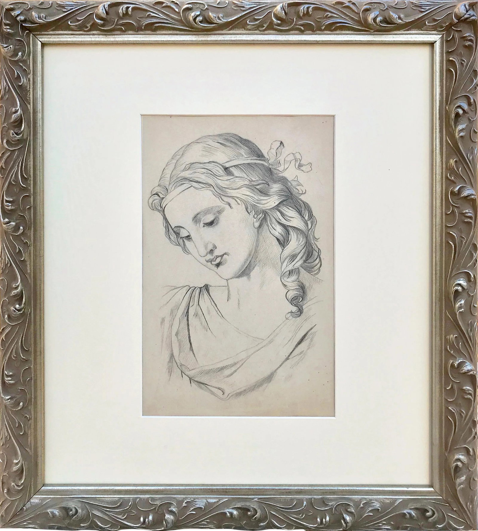19th C Antique Renaissance Style Portrait Drawing of a Woman: 19th Century graphite portrait drawing of a renaissance woman, from a portfolio dated 1885. Presented in cream colored matting and a silver wood frame with acanthus details. Image size: 6.5" x 10",