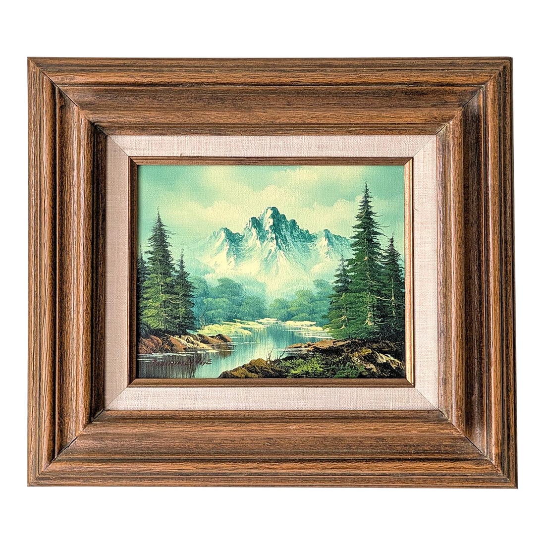 Mid 20th Century Framed Mid Century Oil Painting Signed Joachim Lange: A framed Mid Century painting signed Joachim Lange. The artwork depicts a forrest-lined river valley with mountain background with notably vibrant blue and green hues. Measurements: canvas 8" x 10" |