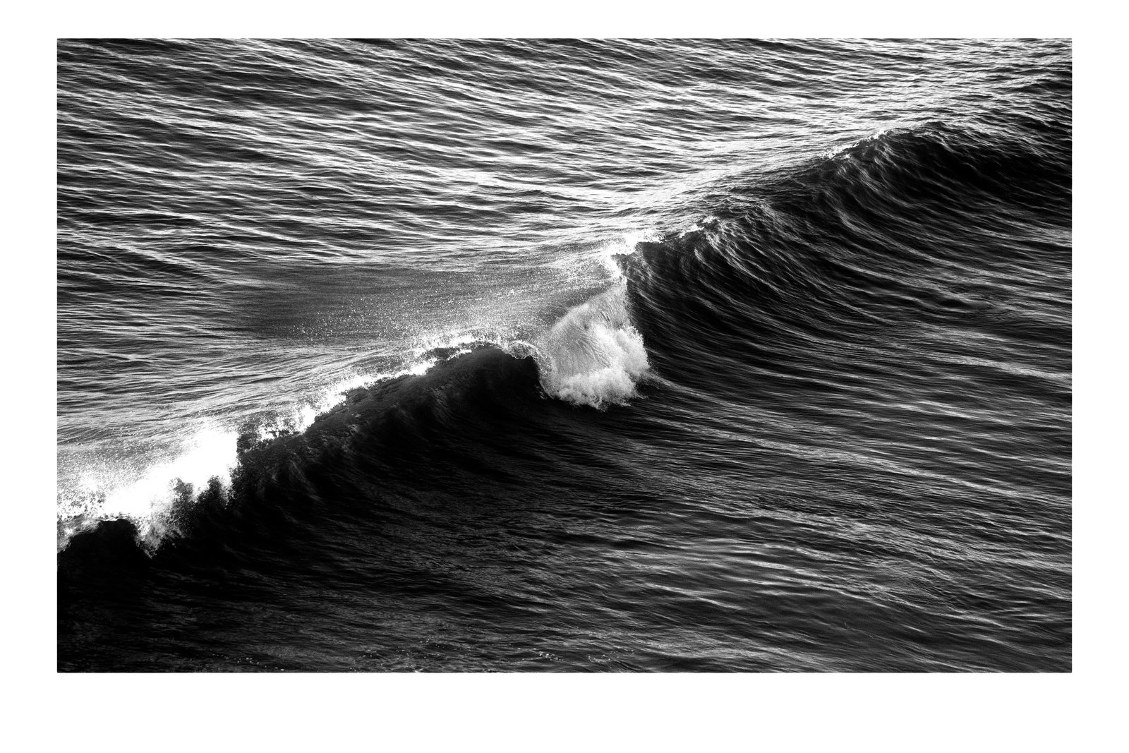 2020 "Long Wave in Venice Beach" Contemporary Giclee Print by Kind of Cyan: This is an exclusive limited edition black and white Giclee print, on 100% cotton Hahnemuhle Photo Rag Fine Art matte paper. This beautiful black and white high contrast photograph is titled "Long