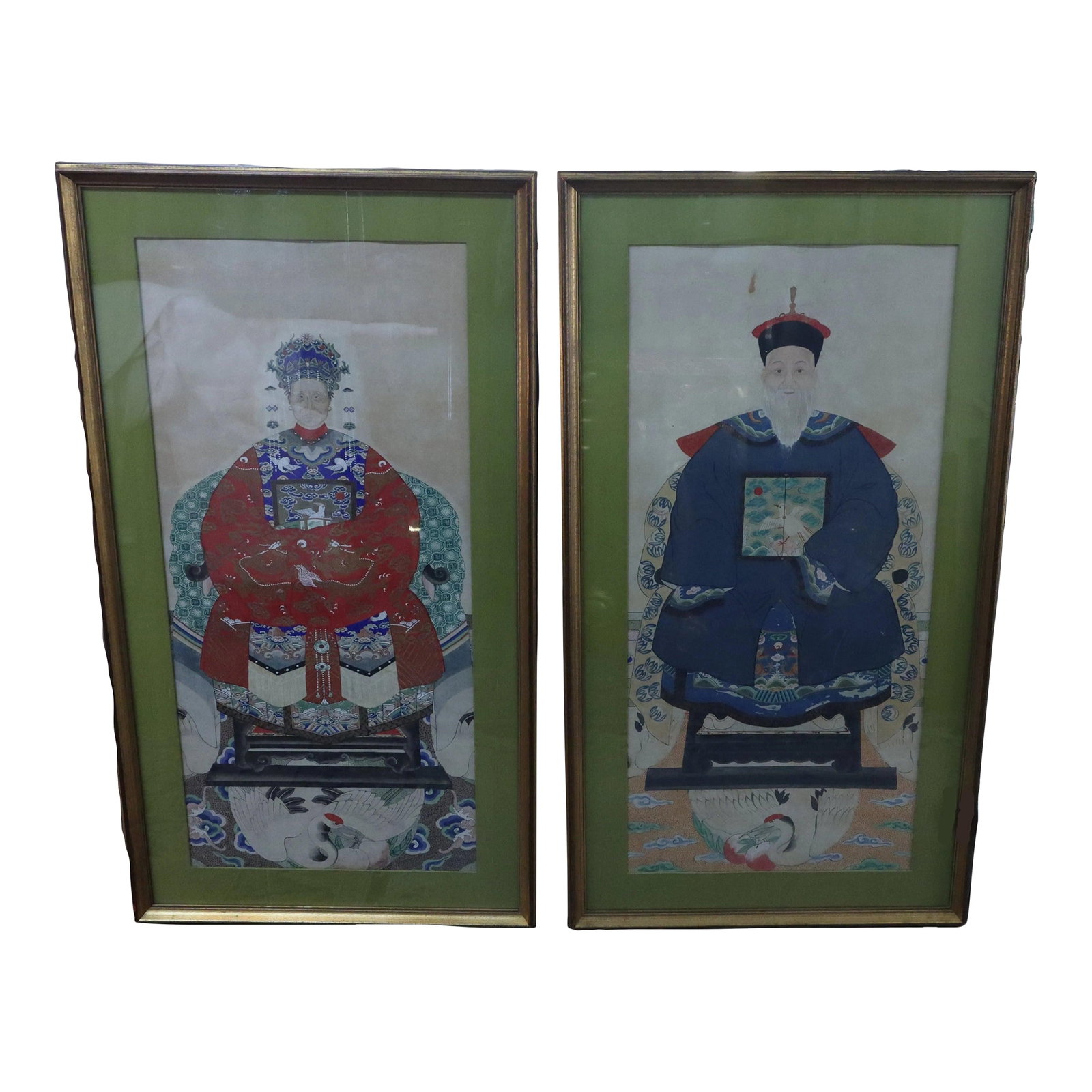 Pair of Large Antique Chinese 19th Century Painted Ancestor Portraits: Fantastic pair of large Chinese 19th century hand painted ancestor portraits. Well framed with olive green mattes that compliment the overall color scheme of the portraits. The woman is depicted in