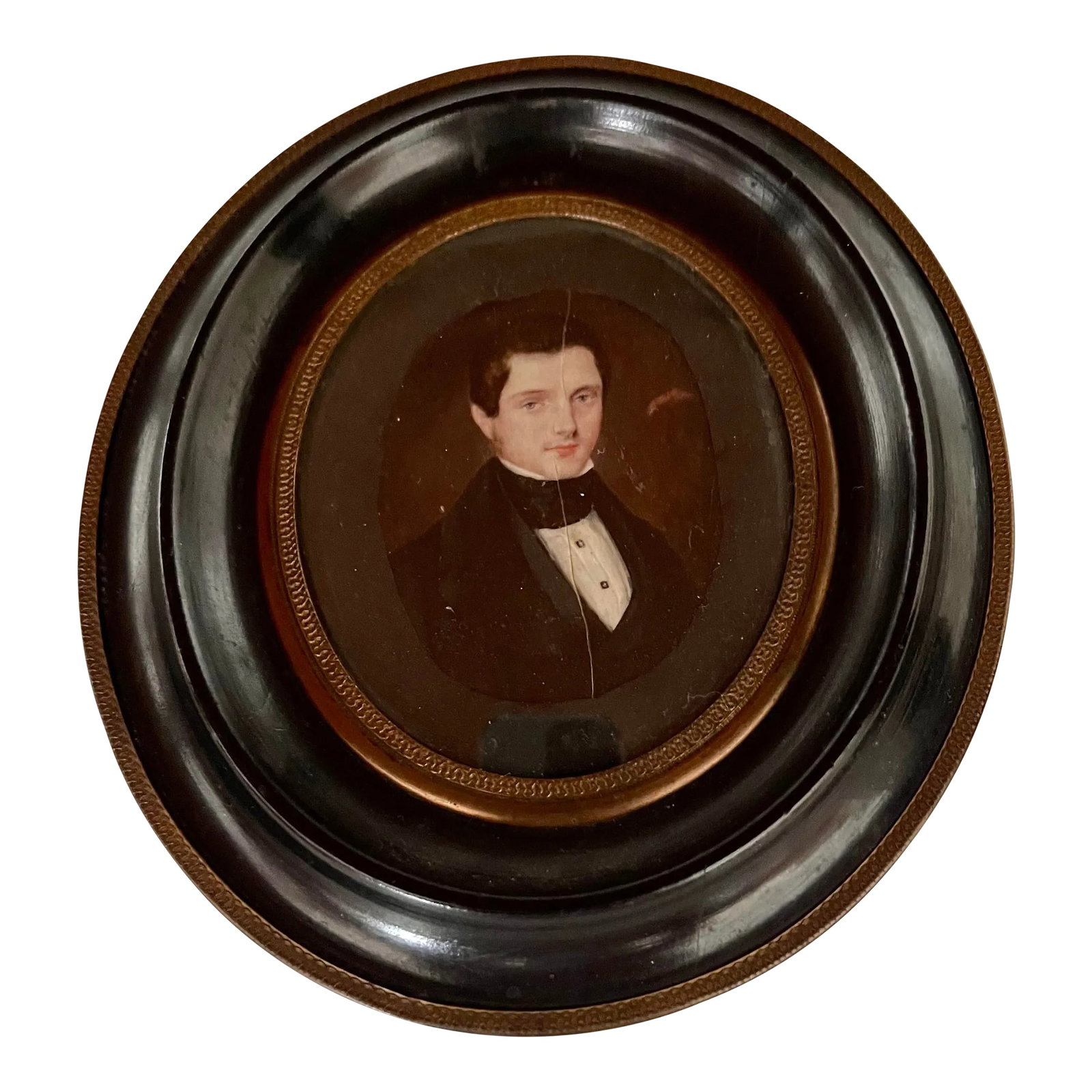 19th Century Miniature Oval Painting of a Young Man, Framed: 19th miniature oval painting representing a young aristocrat in a suit and white shirt tied at the collar with a scarf. The subject is a handsome young man with blue eyes and a haughty bearing. The ov