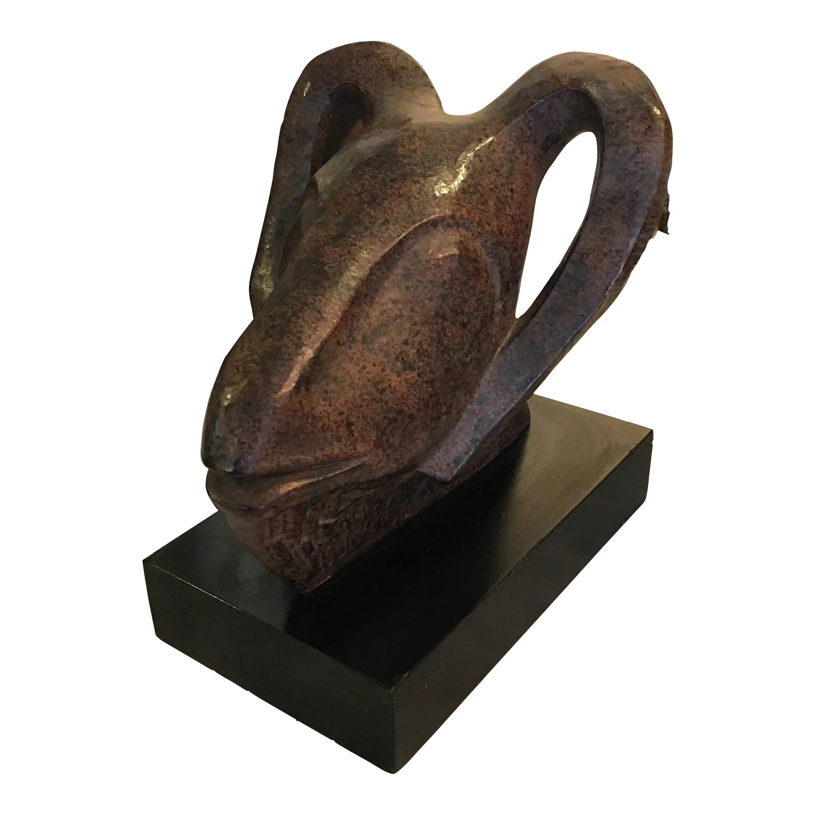 Textured Metal Ram Head Sculpture: Intriguing sculpture made of textured and mottled metal. It boarders on abstract yet it shows the animal head. It has a great coloration and feel to it........a warm friendly face. Mounted onto a