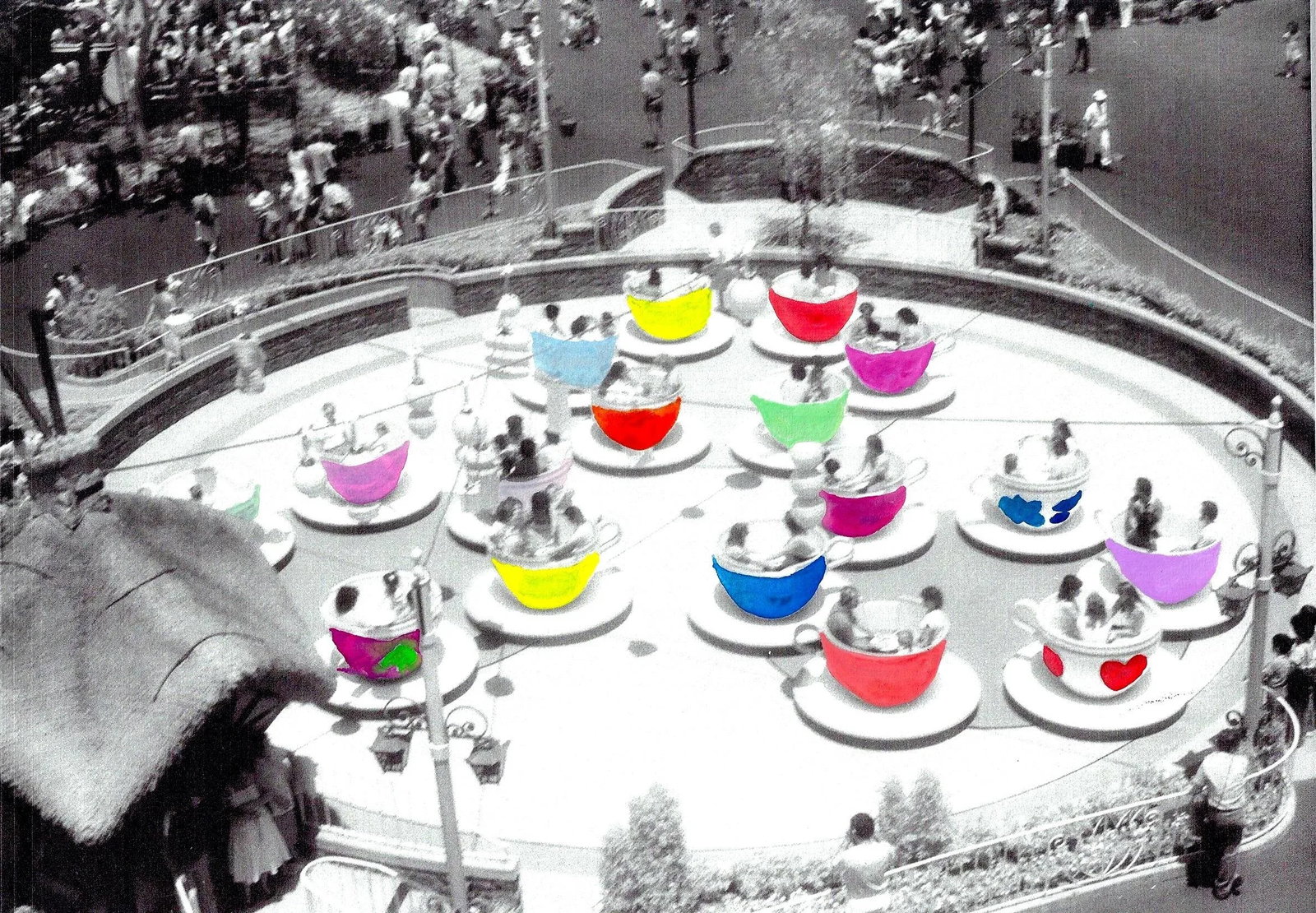 Cups & Saucers Hand-Painted Photograph: The joys of a theme park ride are enhanced by color details in this one-of-a-kind hand colored photographic print. Condition: Imperfections: No Imperfections Origin: United States Materials &