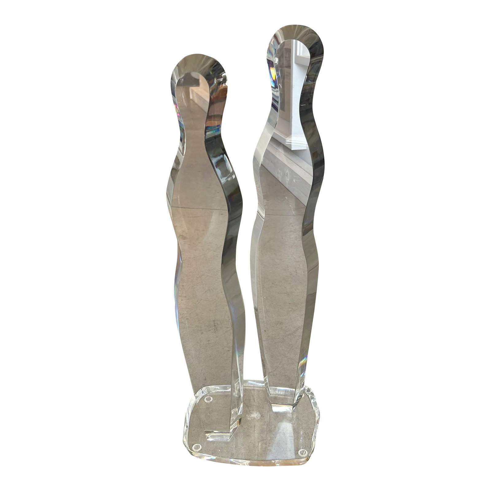 1970s Abstract Beveled Lucite Sculpture: Abstract beveled lucite sculpture depicting 2 people. Excellent condition with one dry interior spot on there base. Made in the 1970s. Condition: Alterations: Original Condition Unaltered