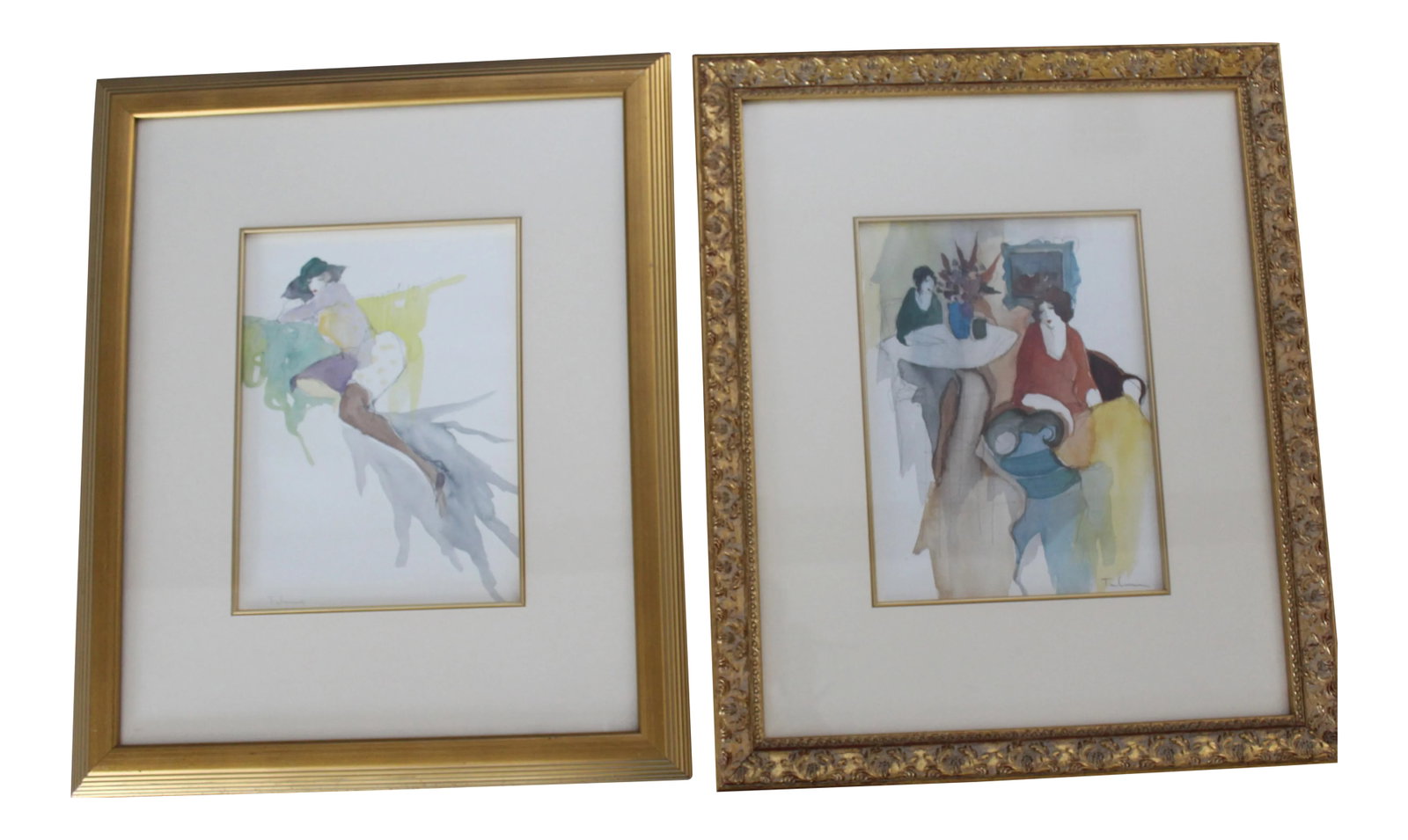 Framed Itzchak Tarkay Prints - A Pair: An offset Serigraphs print on paper by well-listed artist Itzchak Tarkay. One print depicts two women, rendered in Tarkay's signature Post-Impressionistic style, sitting in a lounge, enjoying each