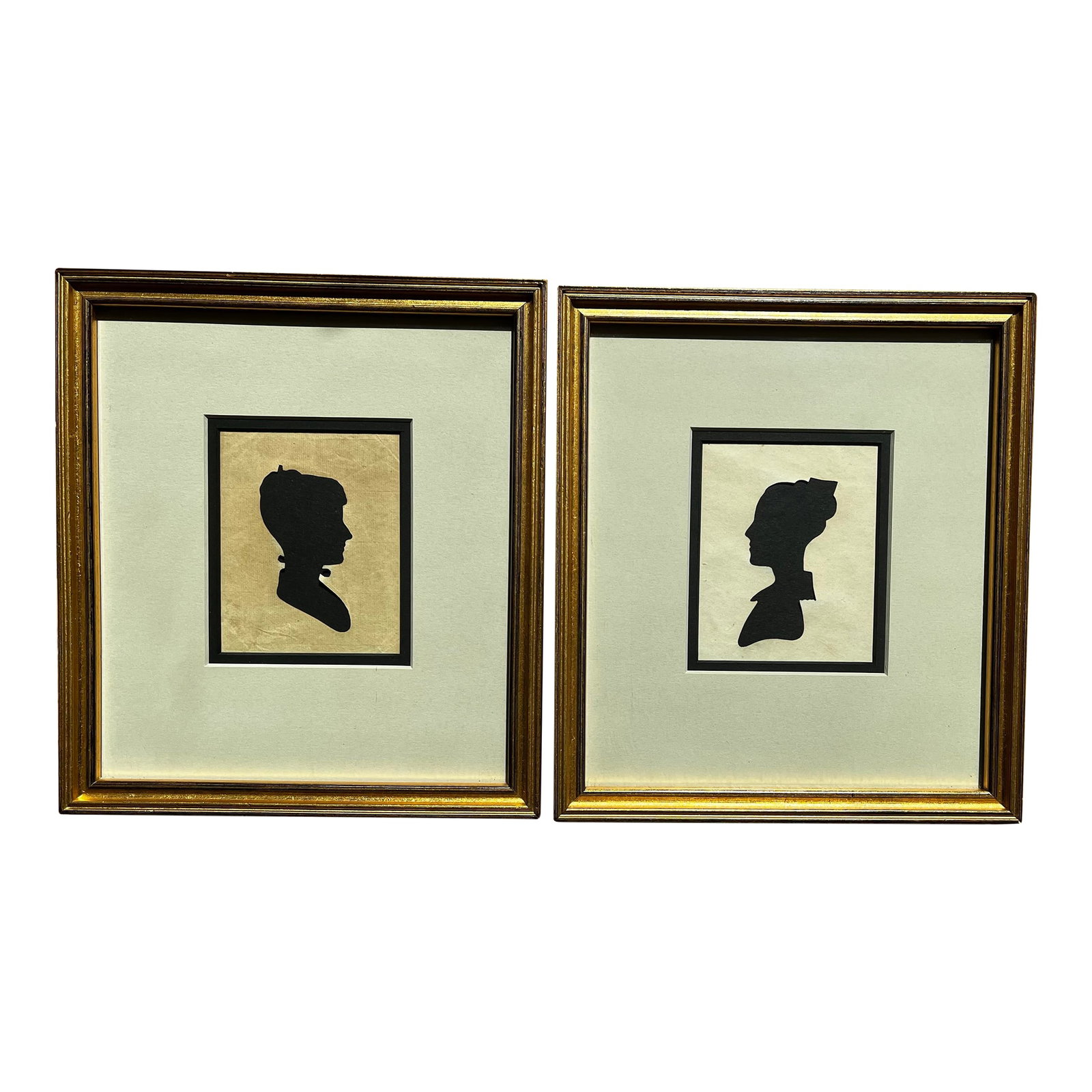 Early 19th Century Pair of Rare Antique Hollow-Cut Silhouettes in Vintage Frames: This pair of hollow-cut silhouettes is a rare find and in such wonderful condition. They have been framed beautifully in a classic, gold tone frame with a double mat of black and sage green. They
