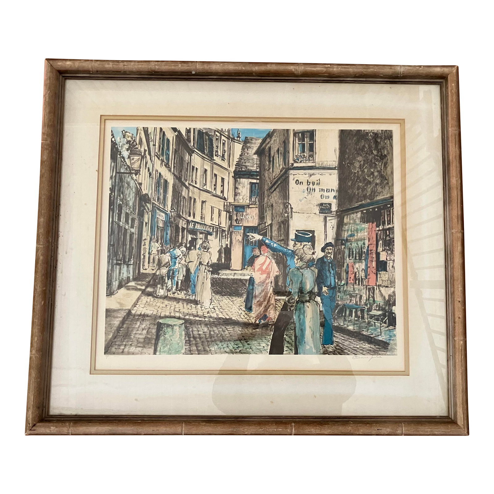 1930s Parisian Street Scene, Artists Proof by Etienne Julia. Signed & Framed: Joyful, colorful Parisian Street Scene Lithograph by French artist Etienne Julia. Buildings outlined by shades of blue show a policeman giving directions to a lady dressed in pink on a busy street.