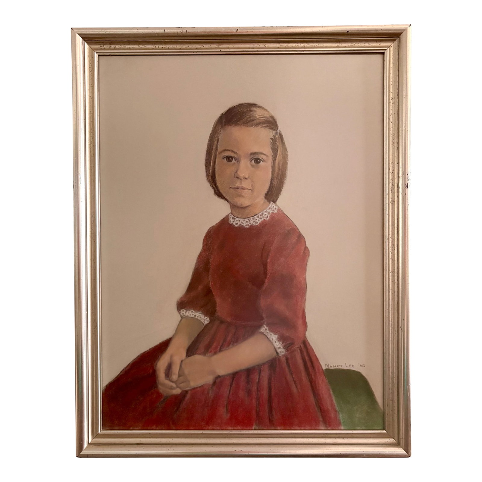 1962 Portrait, Girl in Red Velvet, Pastel on Paper, by Nancy Lee: This serene portrait of a young lady in a red velvet dress with white lace trim is rendered with exquisite detail in pastel on paper by artist Nancy Lee. The custom wood frame is a study in mid-centur