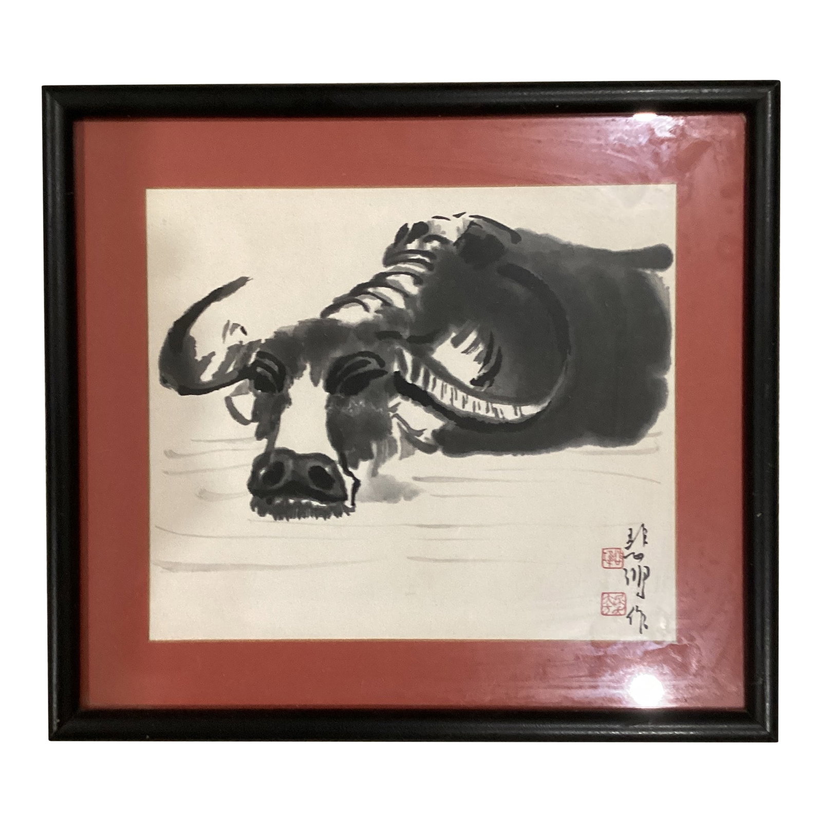 Vintage Ink Monochrome Depiction of a Water Buffalo by Xu Beihong: The product is a vintage ink painting by artist Xu Beihong, depicting a water buffalo. The painting is original, handmade, and signed by the artist. It is framed and made of ink on a medium-sized