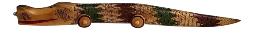 Psikhelekedana Wood Caving of a Flexible Snake on Wheels From Maputo, Mozambique: (YOU CAN MAKE REASONABLE OFFERS.) Psikhelekedana is a special type of miniature wood carving found in Southern Mozambique. The snake has been made such that it can flex. There is a flexible material