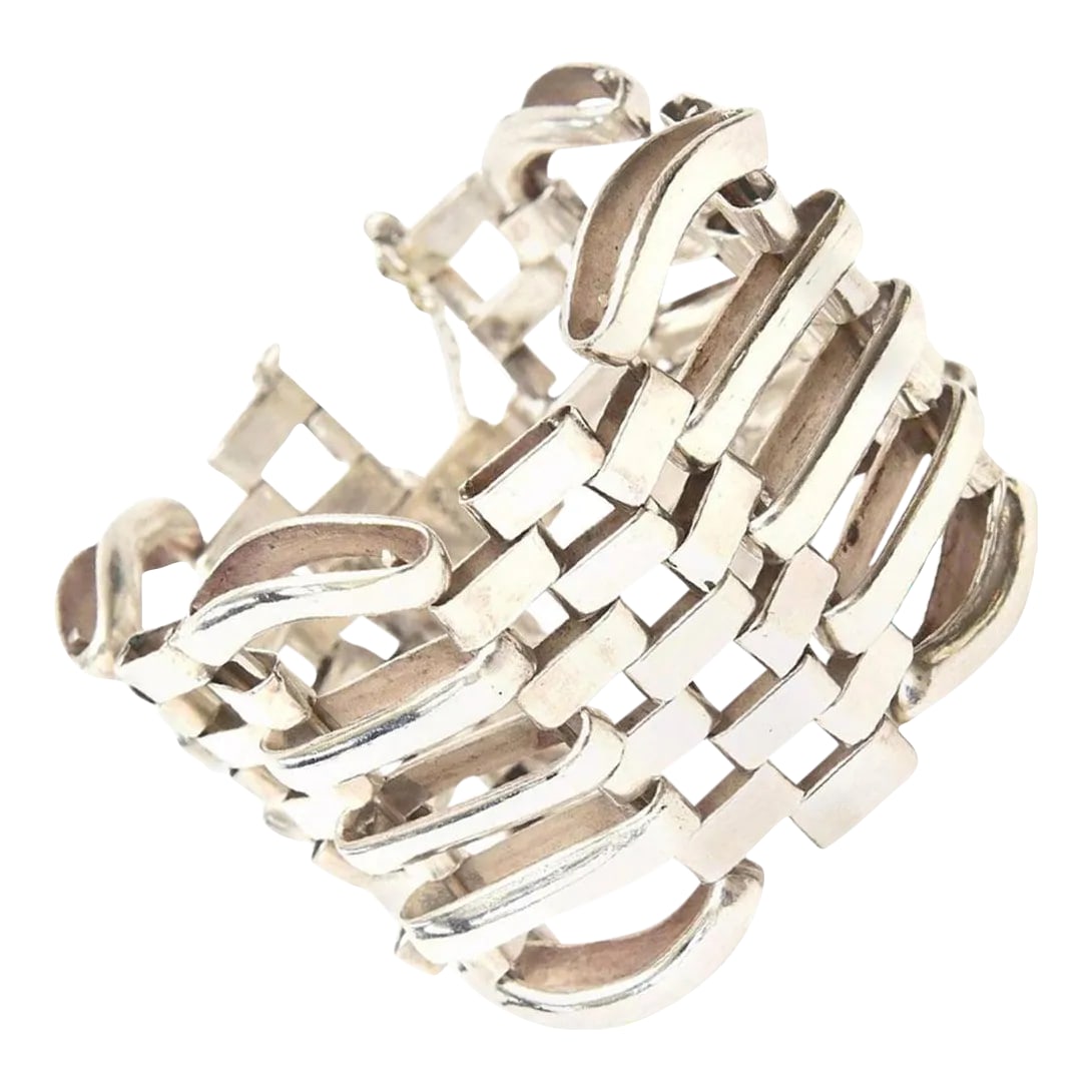 Vintage Sterling Silver Modernist Sculptural Link Cuff Bracelet Hallmarked: This is part of Chairish's Costume Jewelry assortment. This wonderful vintage sterling silver cuff bracelet has great weight to it. It is modernist, minimalist and sculptural all at the same time. It