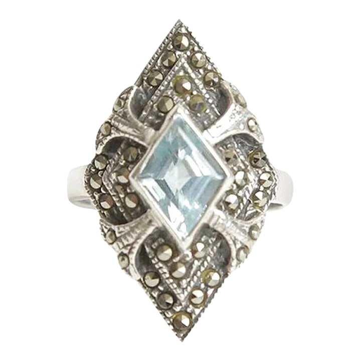 Vintage Art Deco Sterling Silver Blue Topaz and Marquisette Art Deco Ring, Size 8: This is part of Chairish's Costume Jewelry assortment. This lovely vintage art deco ring is a beautiful blue topaz in the center surrounded with marquisettes set against sterling silver. It is a size 