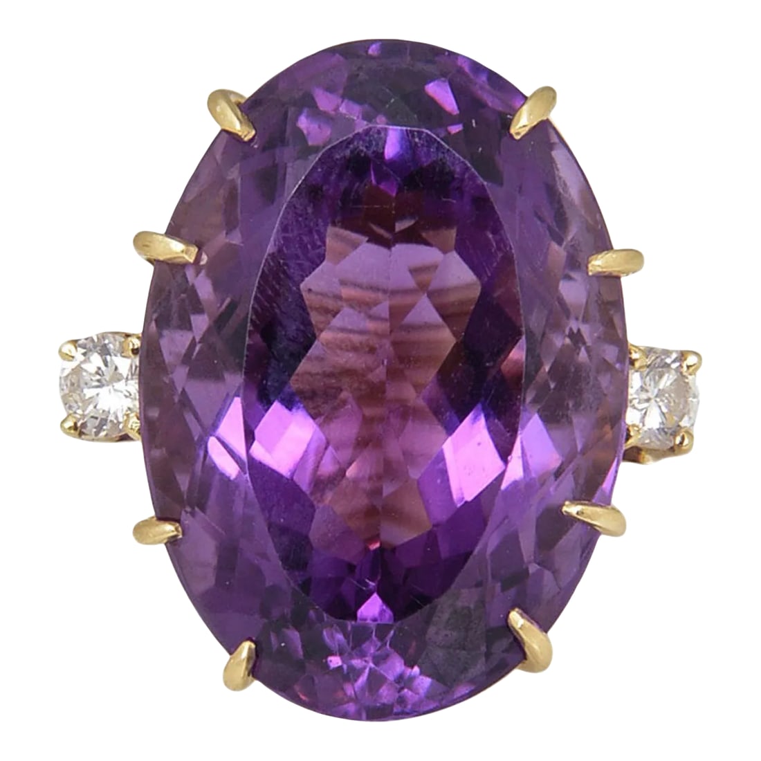 1970s Large Amethyst and Diamond Gold Cocktail Ring size 4: Large Oval Facetted Amethyst approximately 35c prong set with 2 - .25c each diamonds on either side mounted in a 14k yellow gold mounting. US size 4 - It can be made larger. .5 depth is from top of