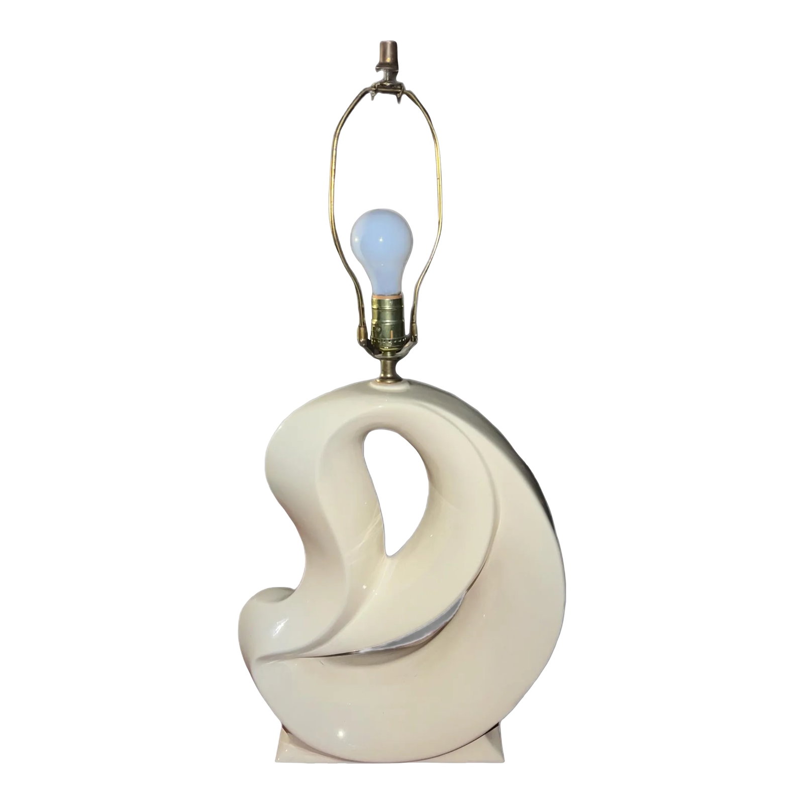 Vintage Mid 20th Century Abstract Sculptural Form Ceramic Table Lamp in White: This vintage off-white colored lamp is an absolute must-have for admirers of abstract art and design! Standing approximately 21.5-inches from the base to the bottom of the bulb, this lamp is made out
