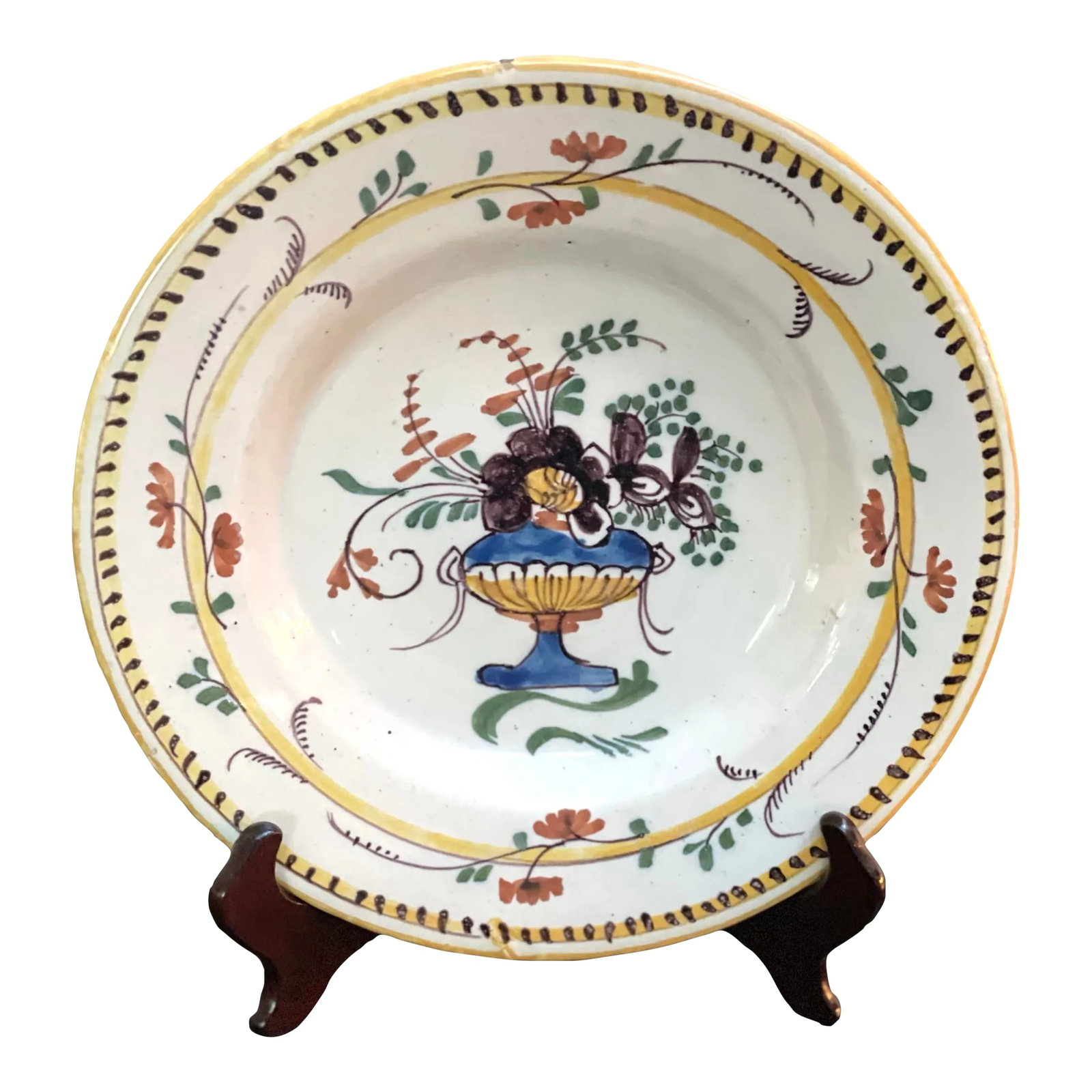 18th Century French Faience Plate, Circa 1780p: This plate is bold and beautiful with a depiction of large bouquet of flowers. Condition: Alterations: Original Condition Unaltered Imperfections: Some Imperfections Condition Notes: This plate is in