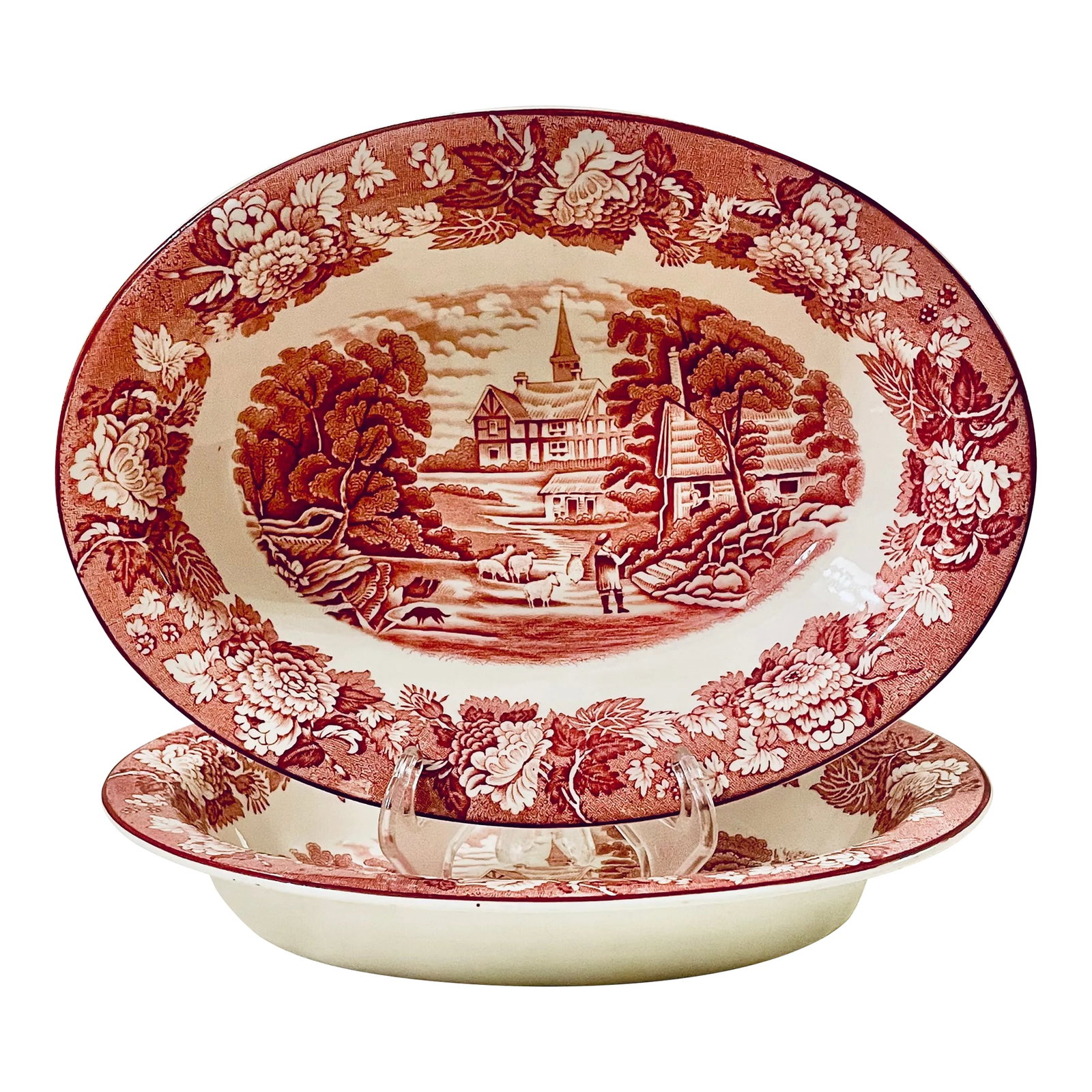 Antique Red Transferware Vegetables, Set of Two: This listing is for a lovely pair of oval vegetable dishes with red transferware decoration depicting a shepherd with sheep with a church and 16th century house in the background. The borders depict f