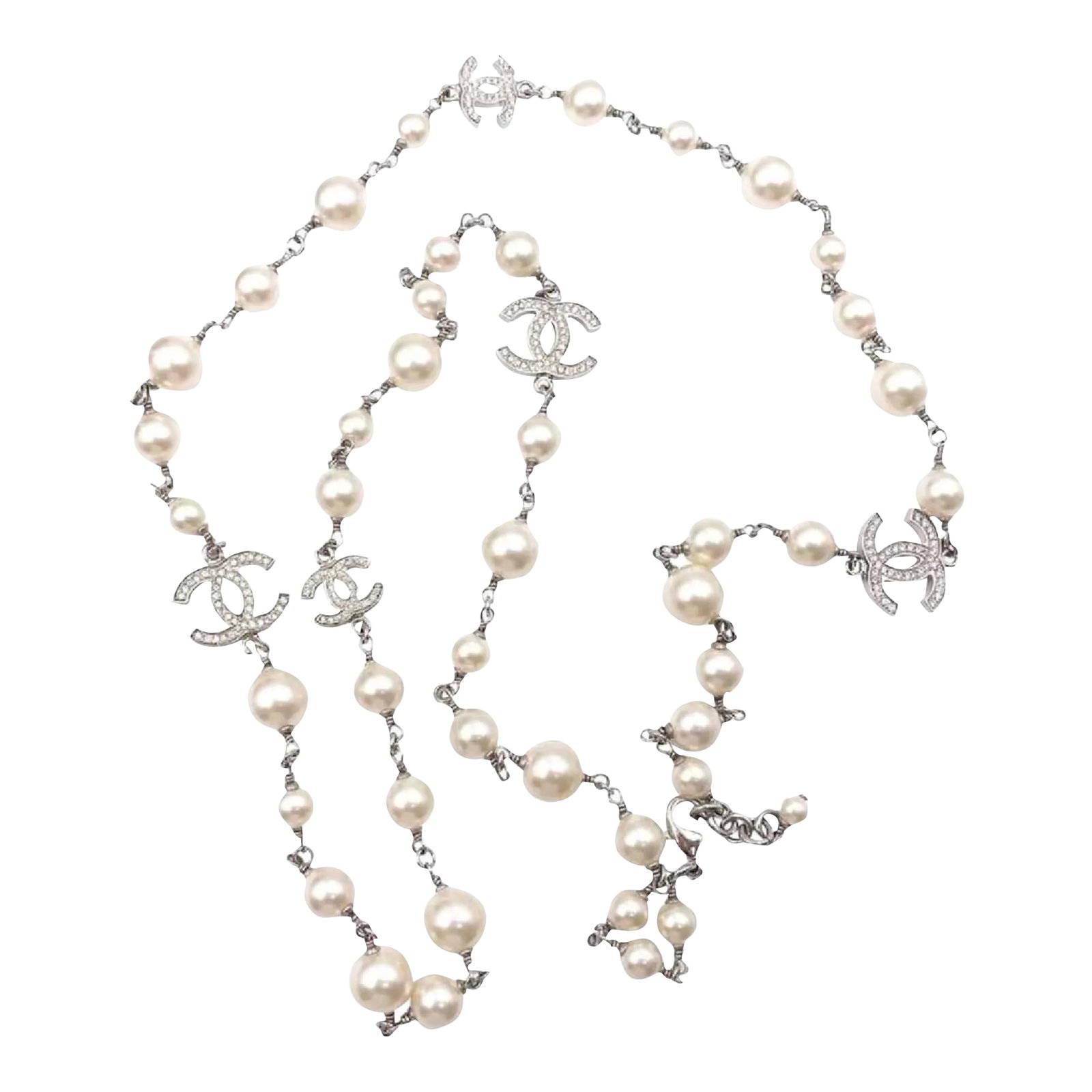 Chanel 5 Silver CC Crystal Faux Pearl Long Necklace: This is part of Chairish's Costume Jewelry assortment. Chanel 5 Silver CC Crystal Faux Pearl Long Necklace * Marked 16 * Made in France *Comes with the original box and pouch -It is approximately 42" 