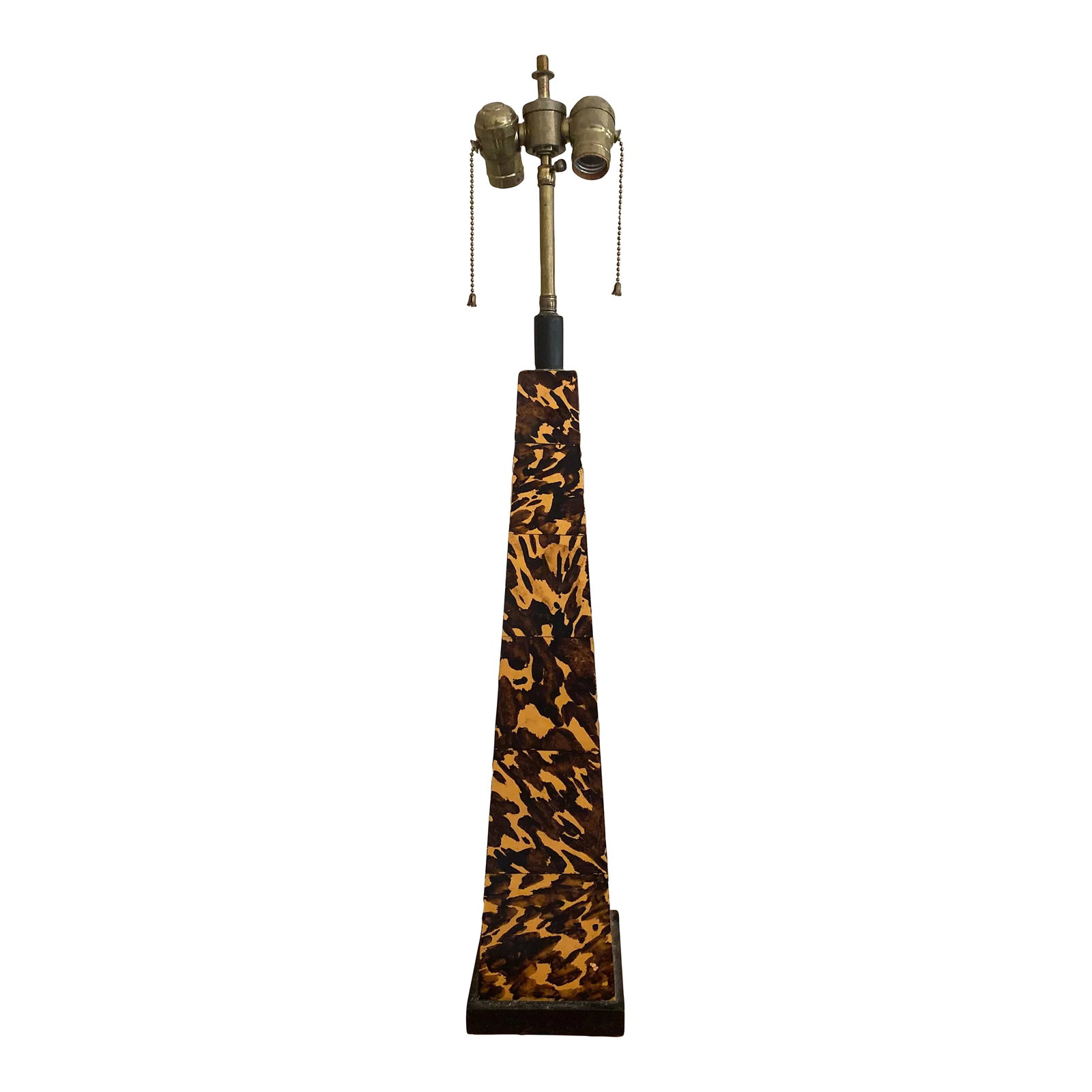 Faux Tortoise Obelisk Lamp, Circa Late 20th Century: Terrific faux tortoise lamp obelisk table lamp. Purchased at NYC's famed D&D building this is a real statement piece. Obelisk 24.5" height, 32" overall Condition: Alterations: Original Condition Unalt