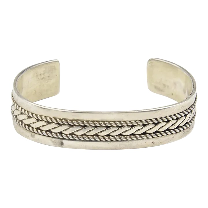 Native American Navajo Sterling Silver Rope & Bead Design Cuff Bracelet by Tom Hawk: This is part of Chairish's Costume Jewelry assortment. Simple sterling silver cuff bracelet was made by well-known Navajo silversmith, Tom Hawk. It has a classic clean design with two beaded lines on