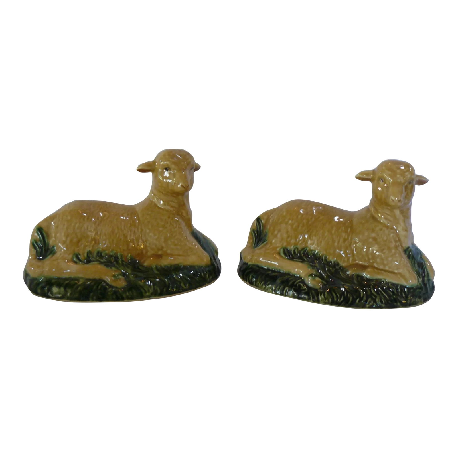 Mid 20th Century Mottahedeh Hand-Painted Lambs, Unmarked - a Pair: Beautiful vintage majolica lambs, made in Portugal for Mottahedeh. These pieces were originally the tops of a pair of basket weave tureens produced for Mottahedeh, and now serve a purely decorative