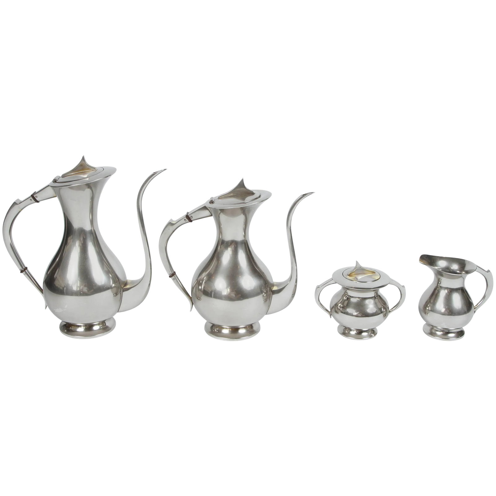 Mid-Century Coffee and Tea Set: Mid-Century coffee set with coffee pot, tea pot, cream and sugar. Newly polished silver plate over brass. Bottom of coffee pot is stamped "silver plate." Coffee pot measurements: 11" L x 5.5 " W x 12"