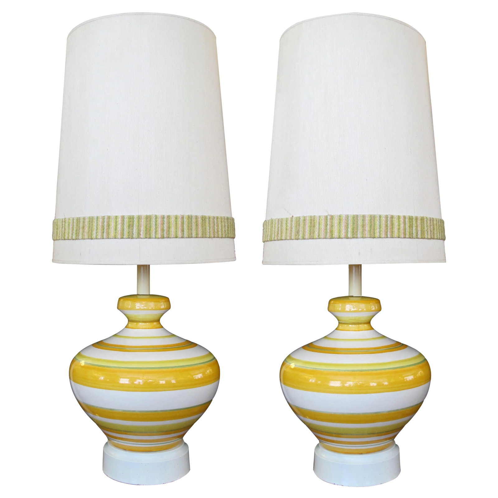 Vibrant & Large-Scaled Italian 1960s Ovoid-Shaped Ceramic Lamps With Bold Horizontal Striping - a Pa: A vibrant and large-scaled pair of Italian 1960's ovoid-shaped ceramic lamps with bold horizontal striping; each portly lamp with horizontal banding; raised on a tole base Condition: Alterations:
