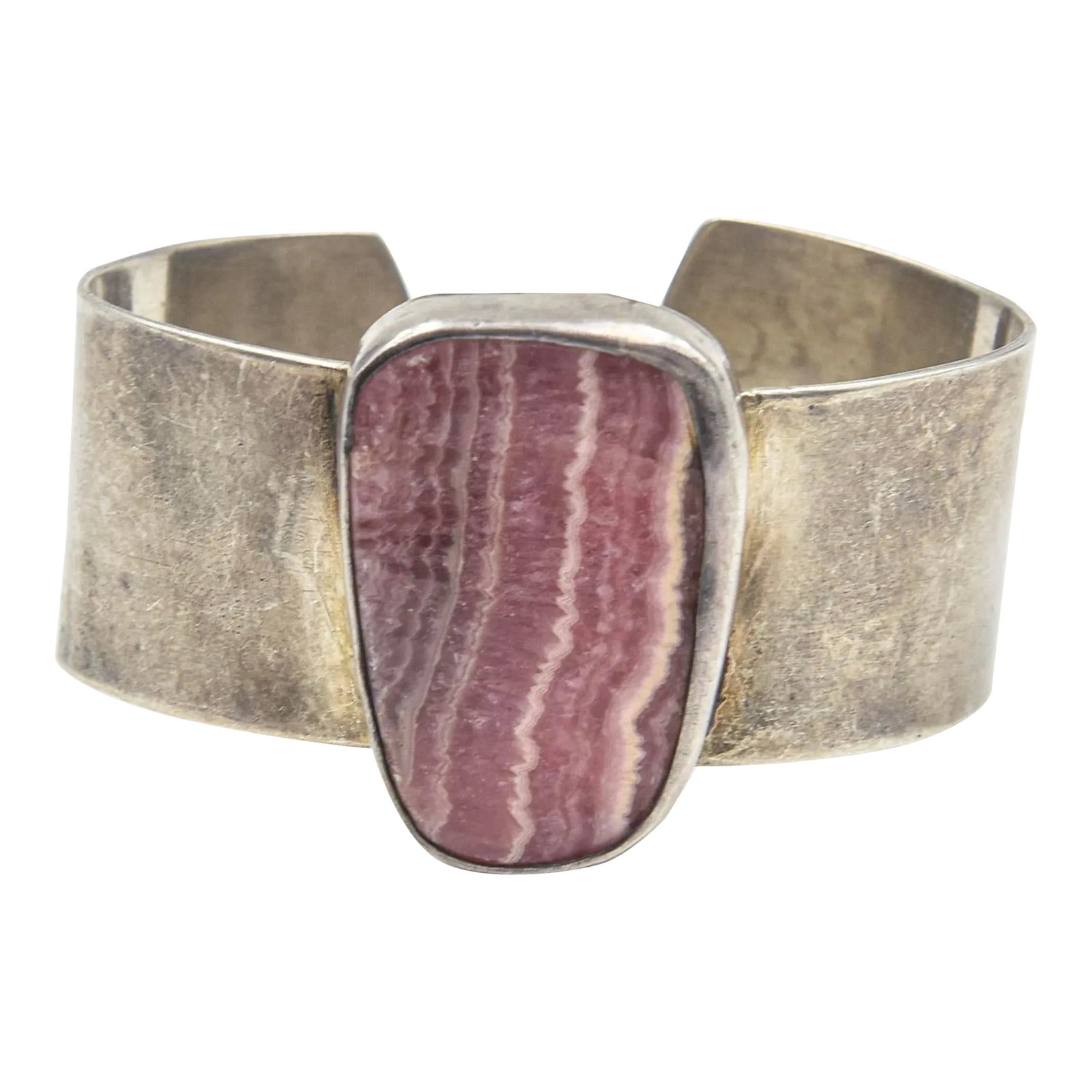 Late 20th Century Native American Sterling Silver and Rhodochrosite Cuff Bracelet: This is part of Chairish's Fine Jewelry assortment. Native American sterling silver and rhodochrosite cuff bracelet. Stone area: 1.46" x 1.03. Interior circumference measures 5 3/4"; cuff can be adjus