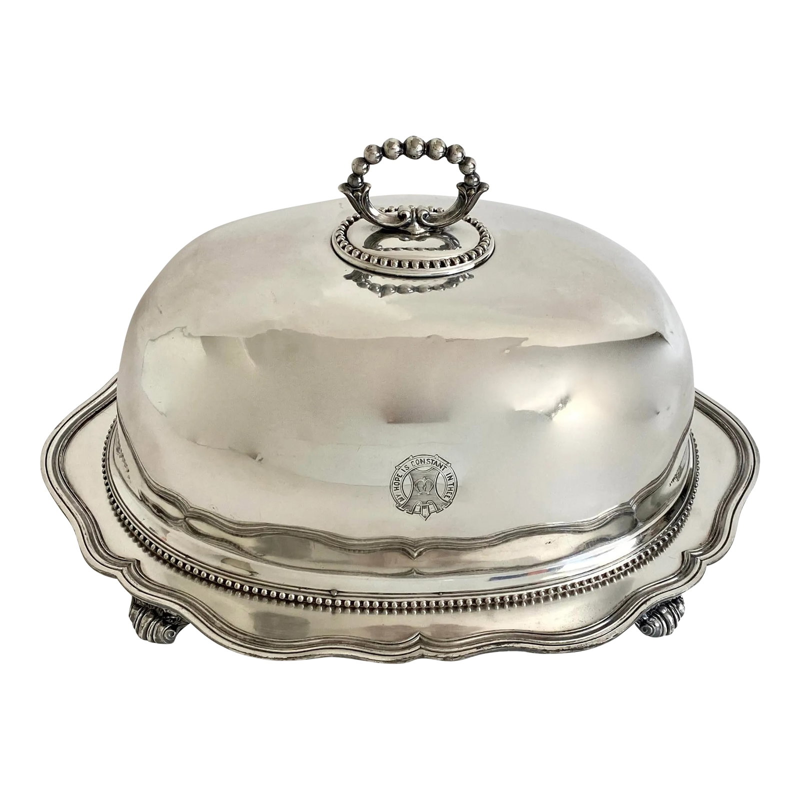 1870s English Silverplate Clanranald Food Dome: This English silverplate food dome dates to the 1870s with a stamp for Thomas Bradbury & Sons. The crest on the front of the dome has a quote, "My Hope is Constant in Thee", the motto of Clanranald.