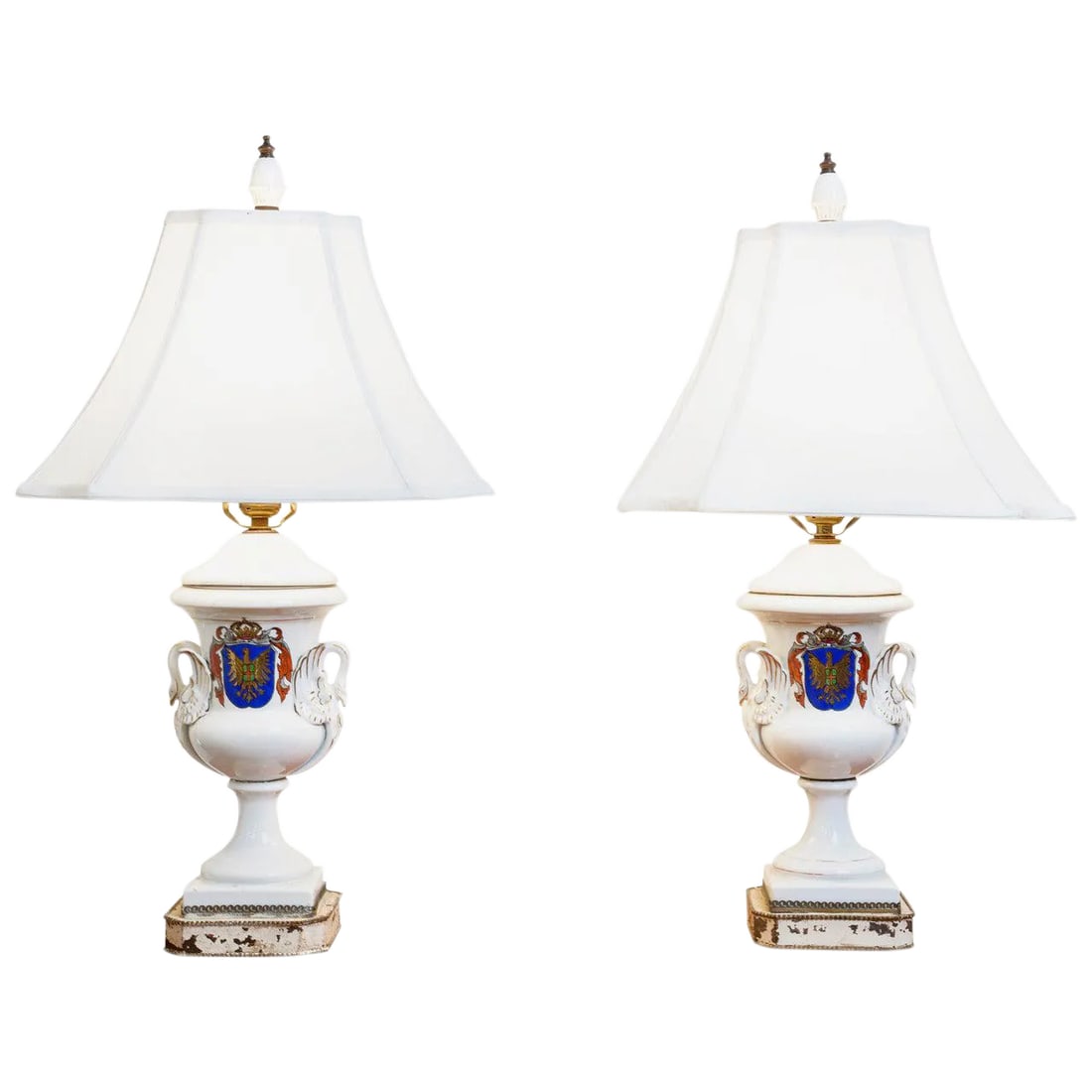 Pair of Old Paris Armorial Urn Lamps, 19th Century France: Lovely pair of old Paris urn lamps, 19th century. Armorial decoration with swan shape handles. Original finials top the lamps. Overall dimensions including shade: 14 inches wide x 25 inches high.