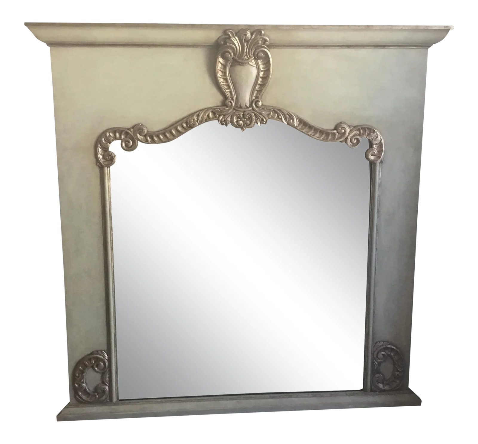 Antiqued Silver Fireplace Frame for a Mirrior: This is a very beautiful carved wood frames for over a fireplace. The finish on the carving is a gold/silver leaf. The color of the wood is a grayish blue/green. The bottom of the frame is flat to