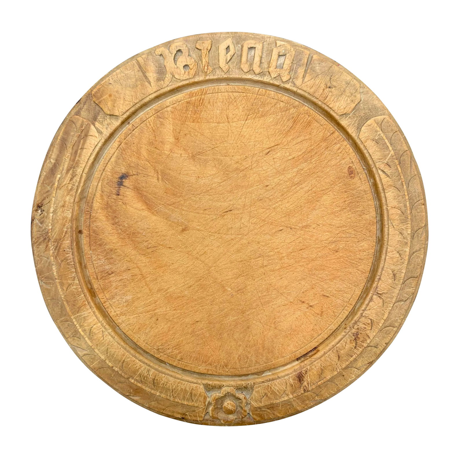 Early 20th Century American Breadboard: A charming early 20th century American burled maple breadboard with the word "BREAD" carved into the top, a flower at the bottom with a long leaf stretching up each side. Boards like these were