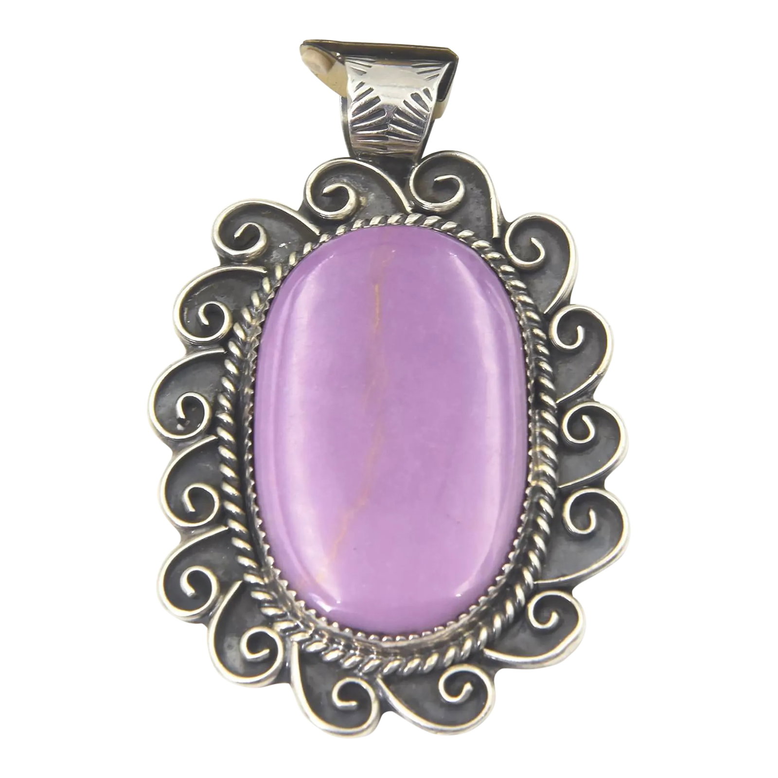 Southwest Navajo Style Sun or Flower Sugilite Sterling Silver Pendant by Kay Johnson: An impressive Navajo-inspired pendant by Arizona silversmith Kay Johnson, the large oval sugilite is set in a saw-tooth bezel and framed in sterling silver rope enhanced by ten hand-made scrolls that