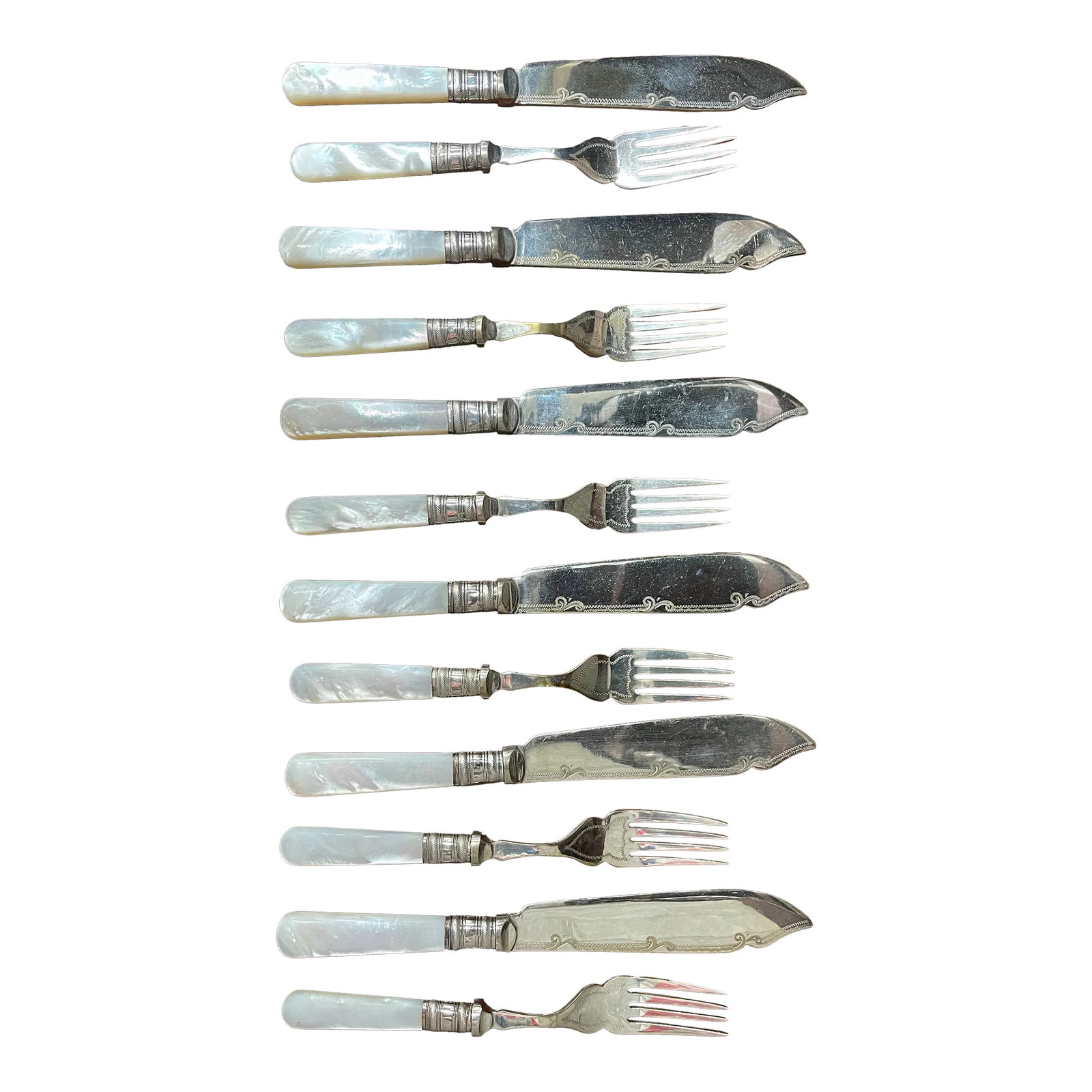 Late 19th Century English Epnss Fish Service Knives and Forks With Mother of Pearl Handles- Set of 1: This boxed set of Victorian knives and forks used for fish service are great for dessert course or fruit and cheese service as well. The mother of pearl handles add elegance to any table. Condition: A