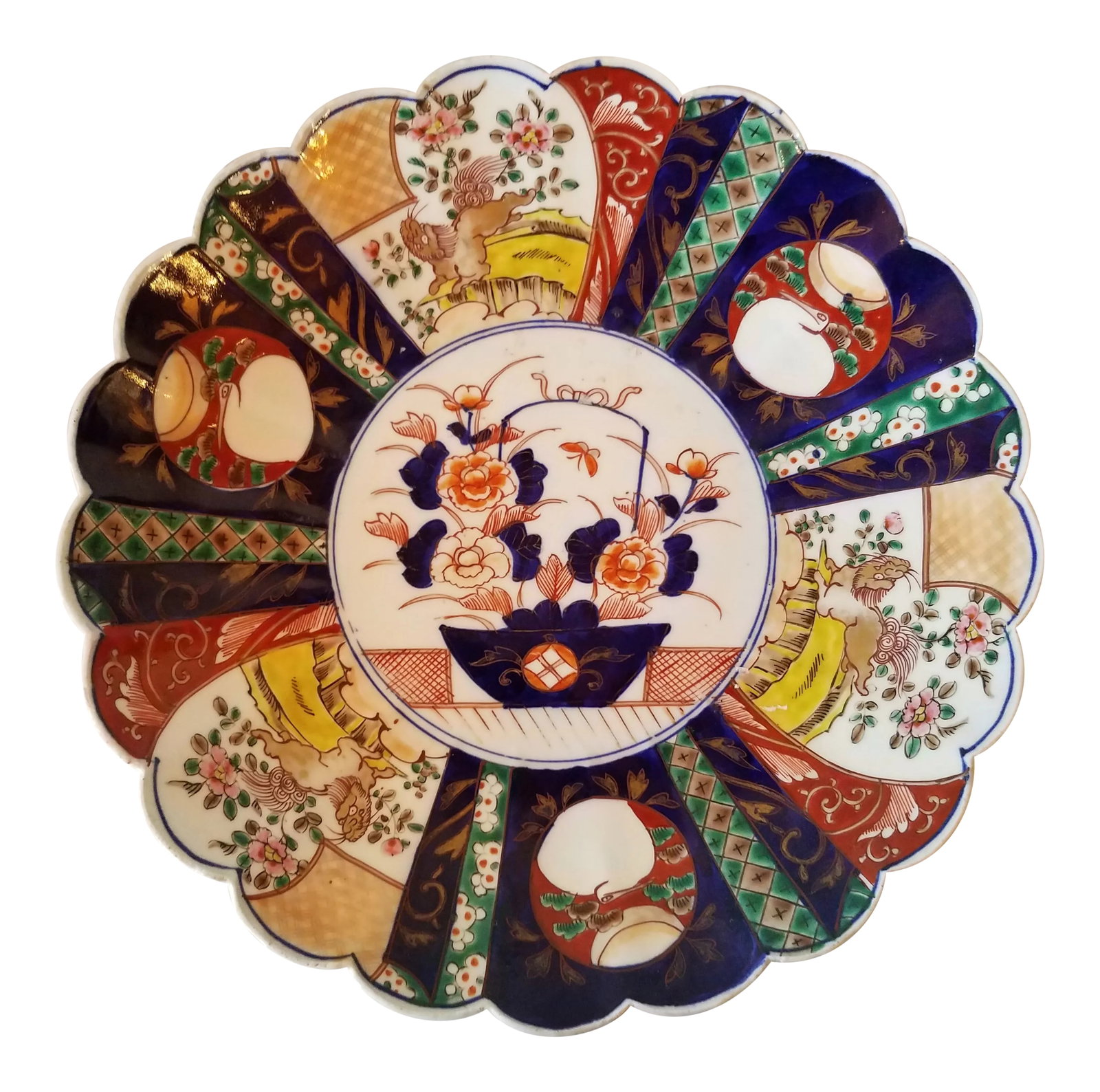 Antique Late 19th Century Imari Porcelain Plate: Large Antique Imari Plate - Circa - Late 19th Century We found this piece in England from a great resource that has very different ceramics. The colors and all the different little details make this