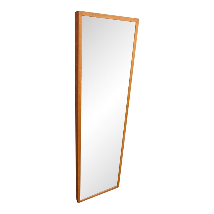 Mid Century Modern Oak Mirror: This wall mirror features a classic mid-century modern design with a warm teak wood frame. Tall and narrow, it's perfect for an entryway, bedroom, or dressing area. The mirror retains its original