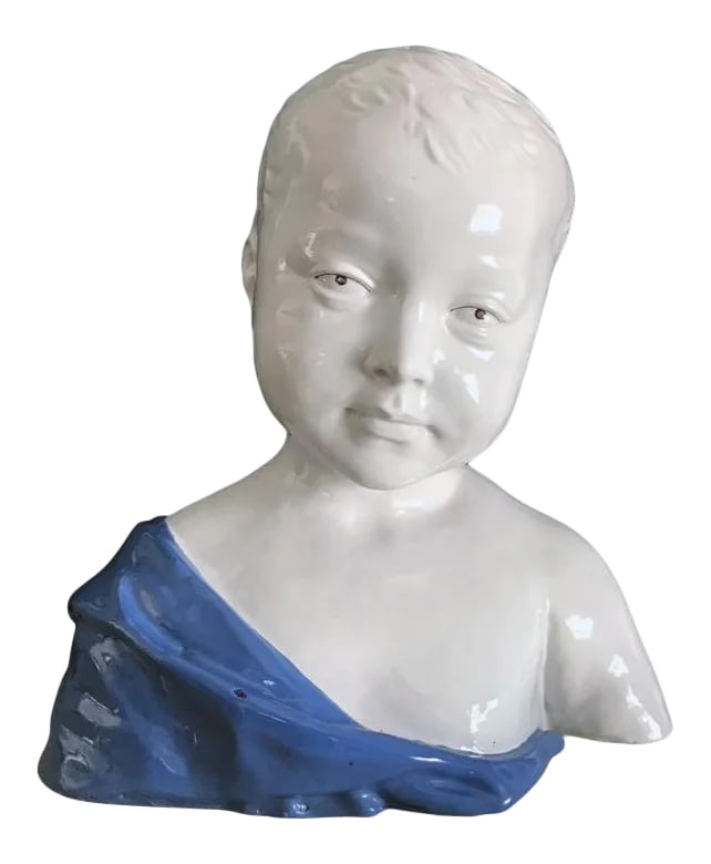 19th Century Glazed Ceramic Bust of a Boy by Cantagalli, Florence, Italy: Exceedingly charming ceramic 'Busto di Bambino' in the Italian Renaissance style. With the blue and white glaze typical of artist Andrea Della Robbia, this bust is modeled after the marble original