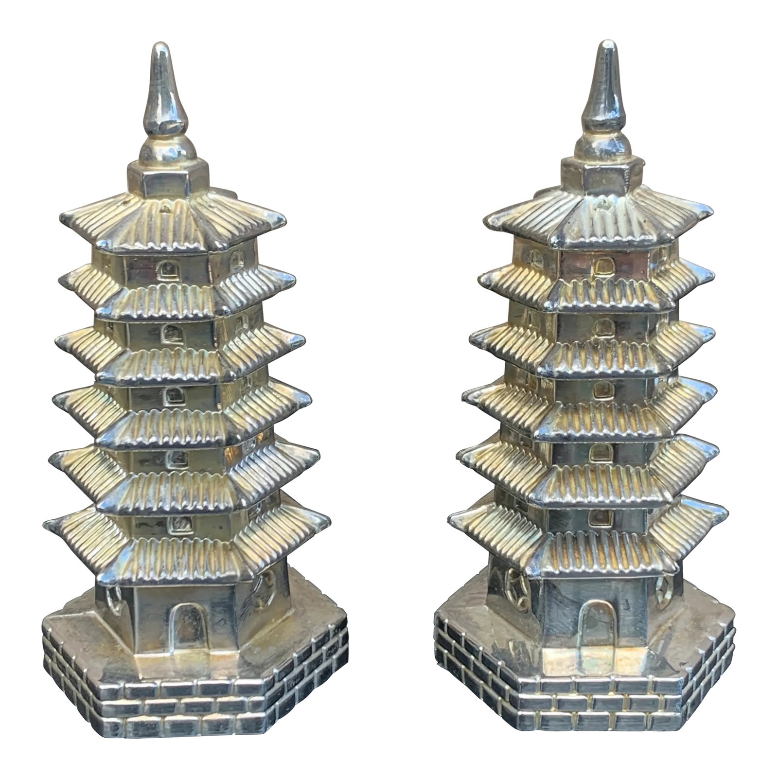 1970s Godinger Silver Plate Chinoiserie Pagoda Salt & Pepper Shakers: A wonderfully whimsical pair of circa 1970s Godinger salt and pepper shakers modeled as traditional tiered pagodas. Executed in silver plate, each miniature structure is surprisingly detailed, from