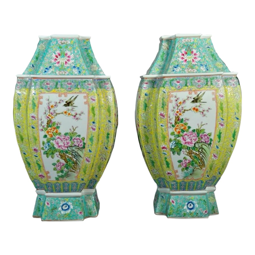 Pair of Mid 20th Century Large Chinese Famille Rose Vases: A lovely pair of large 20th century vases in an unusual shape. Beautiful colors in Famille Rose pattern adorn these vases in excellent condition. Marked on the bottom. Condition: Alterations: