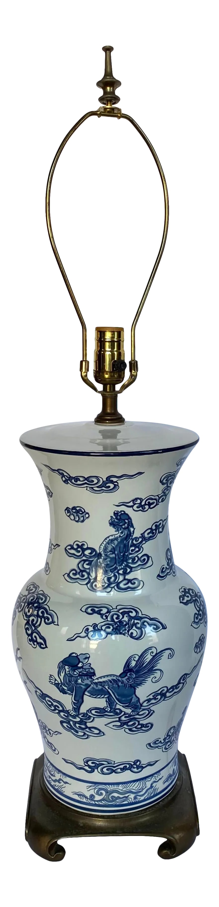 Blue and White Chinoiserie Porcelain Ginger Jar Table Lamp: Large Chinoiserie style blue and white porcelain ginger jar table lamp mounted on Ming style brass base. Classic vase shaped body is decorated with Chinese motifs, foo dogs and blue coral. Lamp shade