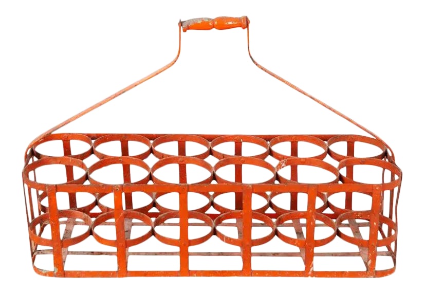 French Early 20th Century Bottle Carrier: Early 20th century, circa 1900, 12 bottle carrier basket from France. Handmade bottle rack, made of metal with a wooden handle. Wonderful, aged patina gives this basket layers of character. Condition: